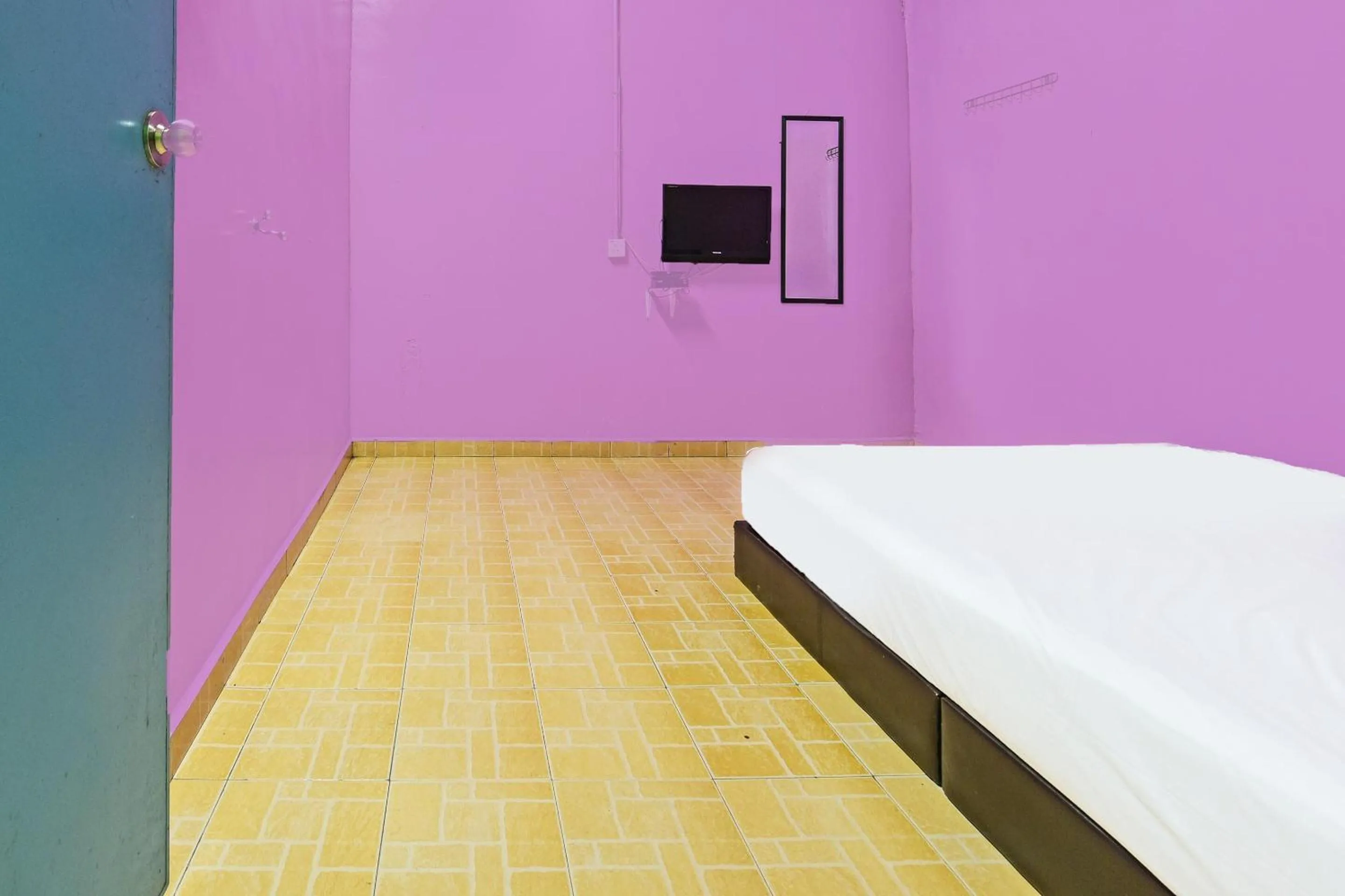 Bedroom in SPOT ON 90144 Corridor Hotel 1