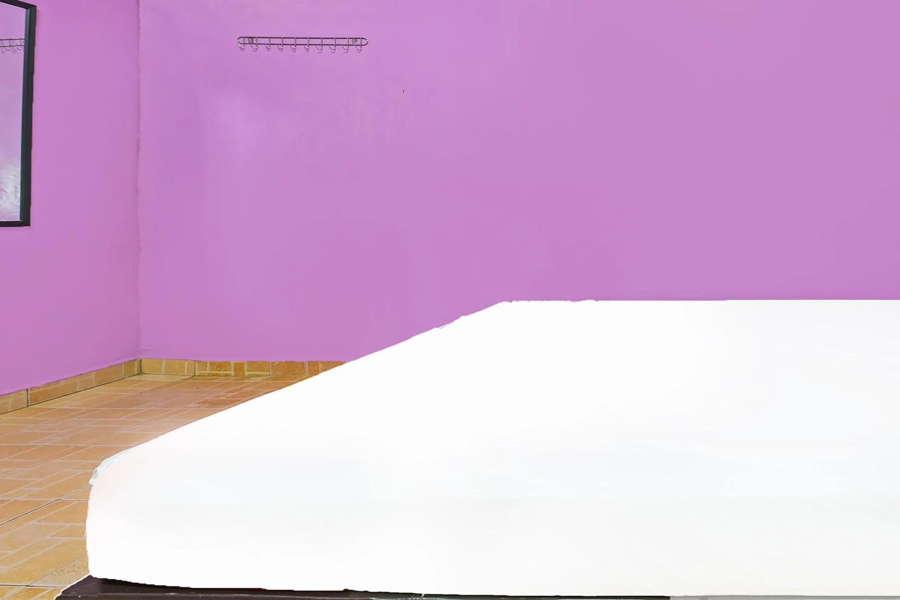 Bedroom in SPOT ON 90144 Corridor Hotel 1