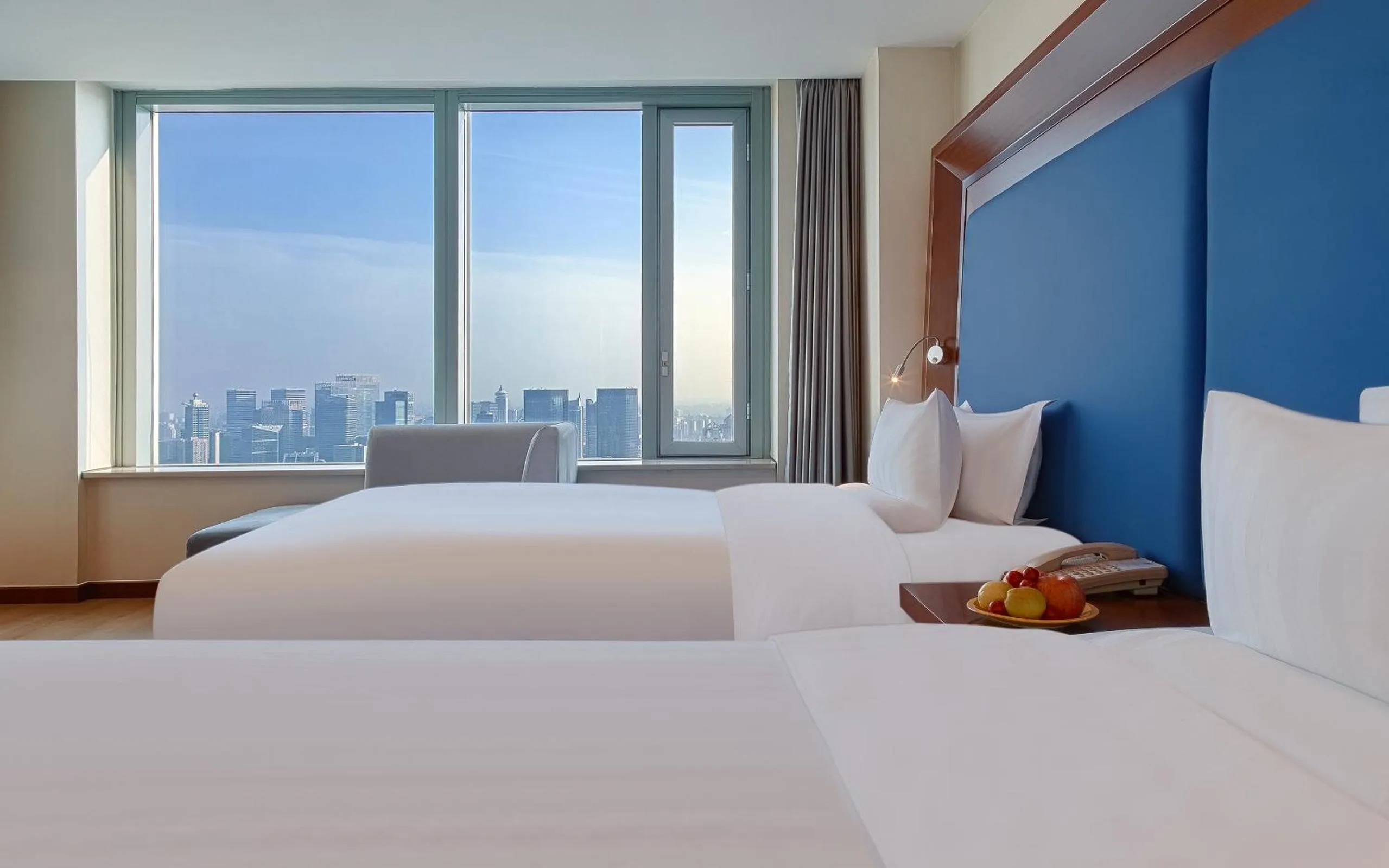 Bed in Novotel Atlantis Shanghai - Enjoy our great-valued breakfast in our rooftop revolving restaurant with a stunning river view & utilize our FREE self-serviced laundry