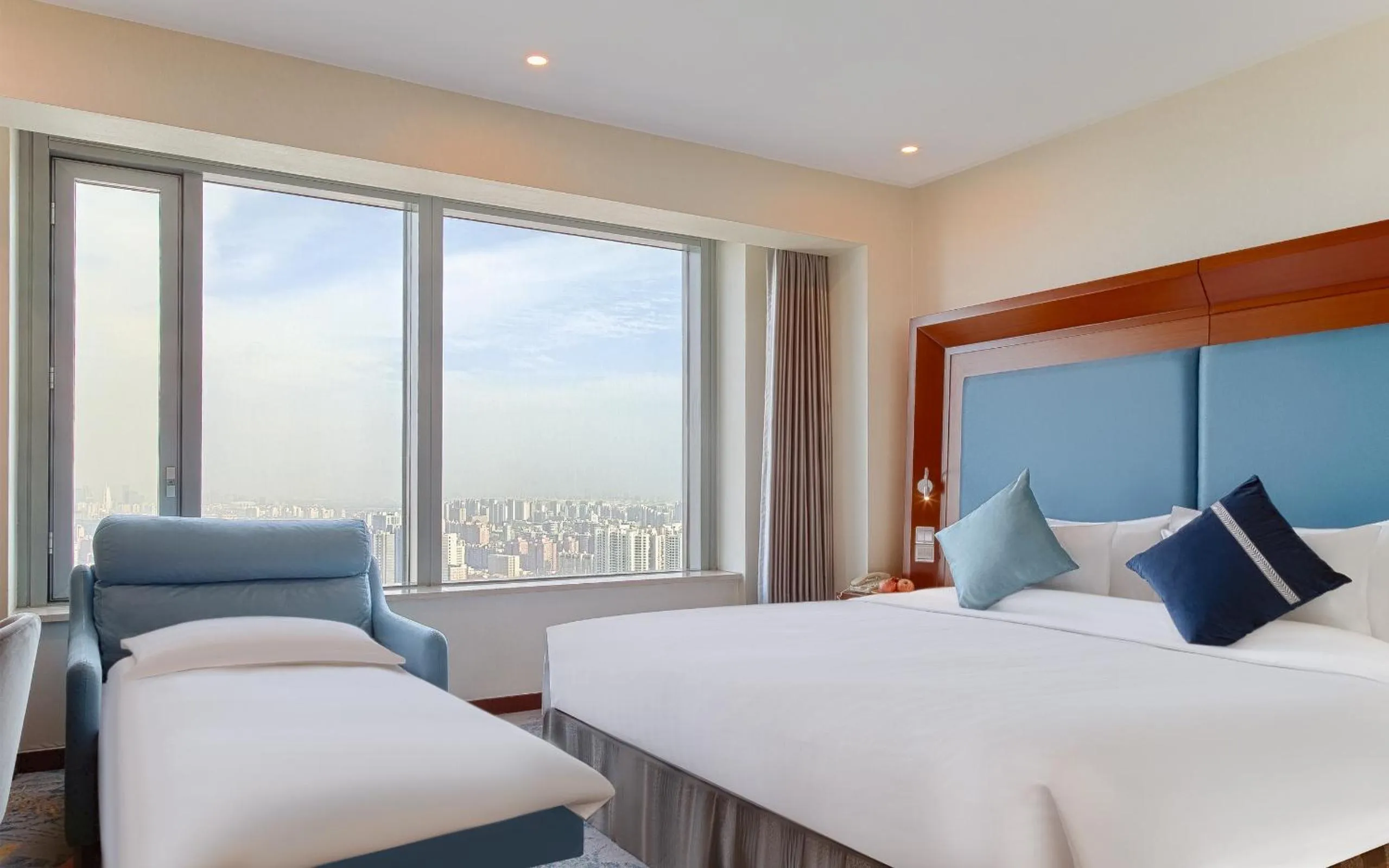Bed in Novotel Atlantis Shanghai - Enjoy our great-valued breakfast in our rooftop revolving restaurant with a stunning river view & utilize our FREE self-serviced laundry
