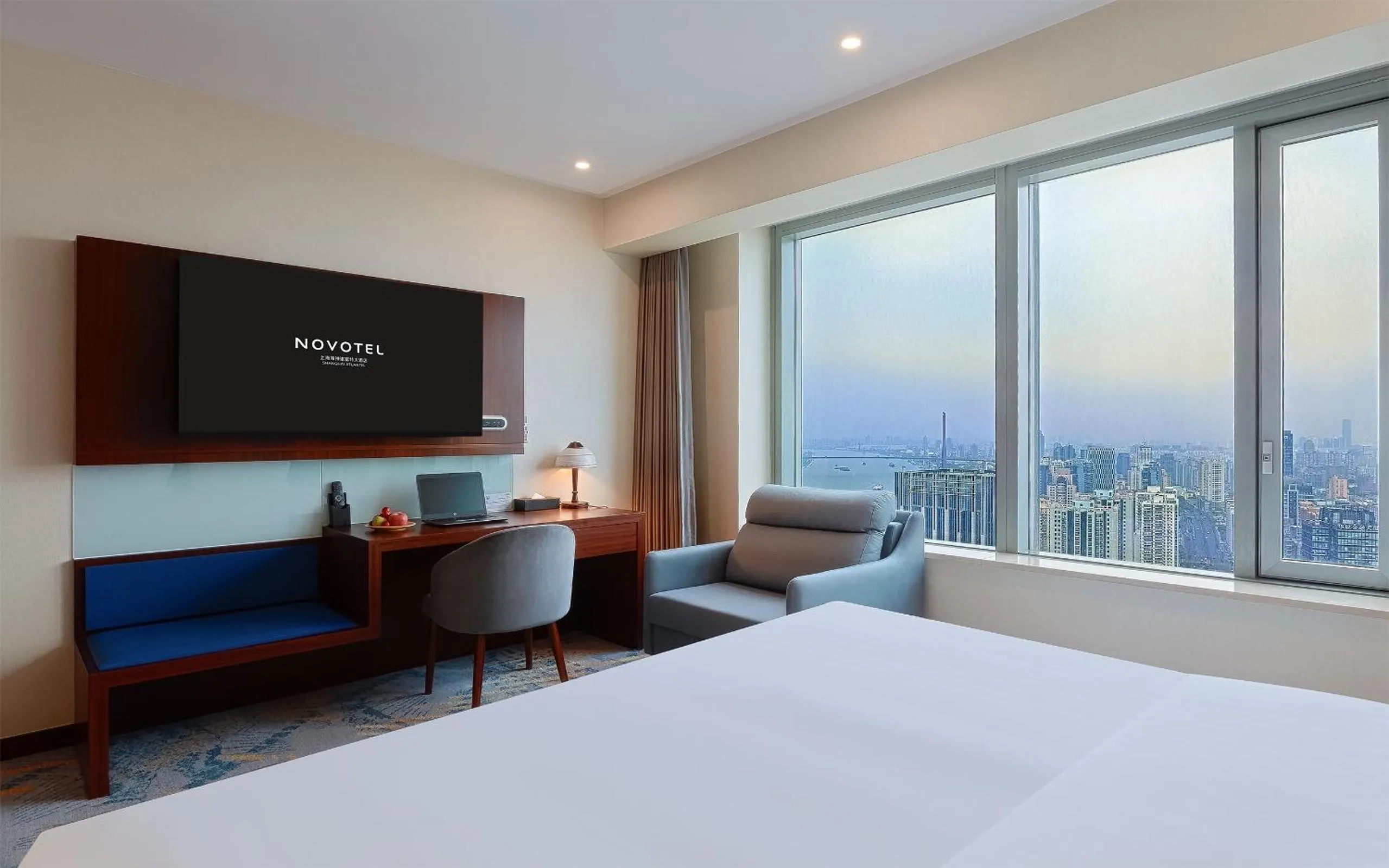 Bed in Novotel Atlantis Shanghai - Enjoy our great-valued breakfast in our rooftop revolving restaurant with a stunning river view & utilize our FREE self-serviced laundry