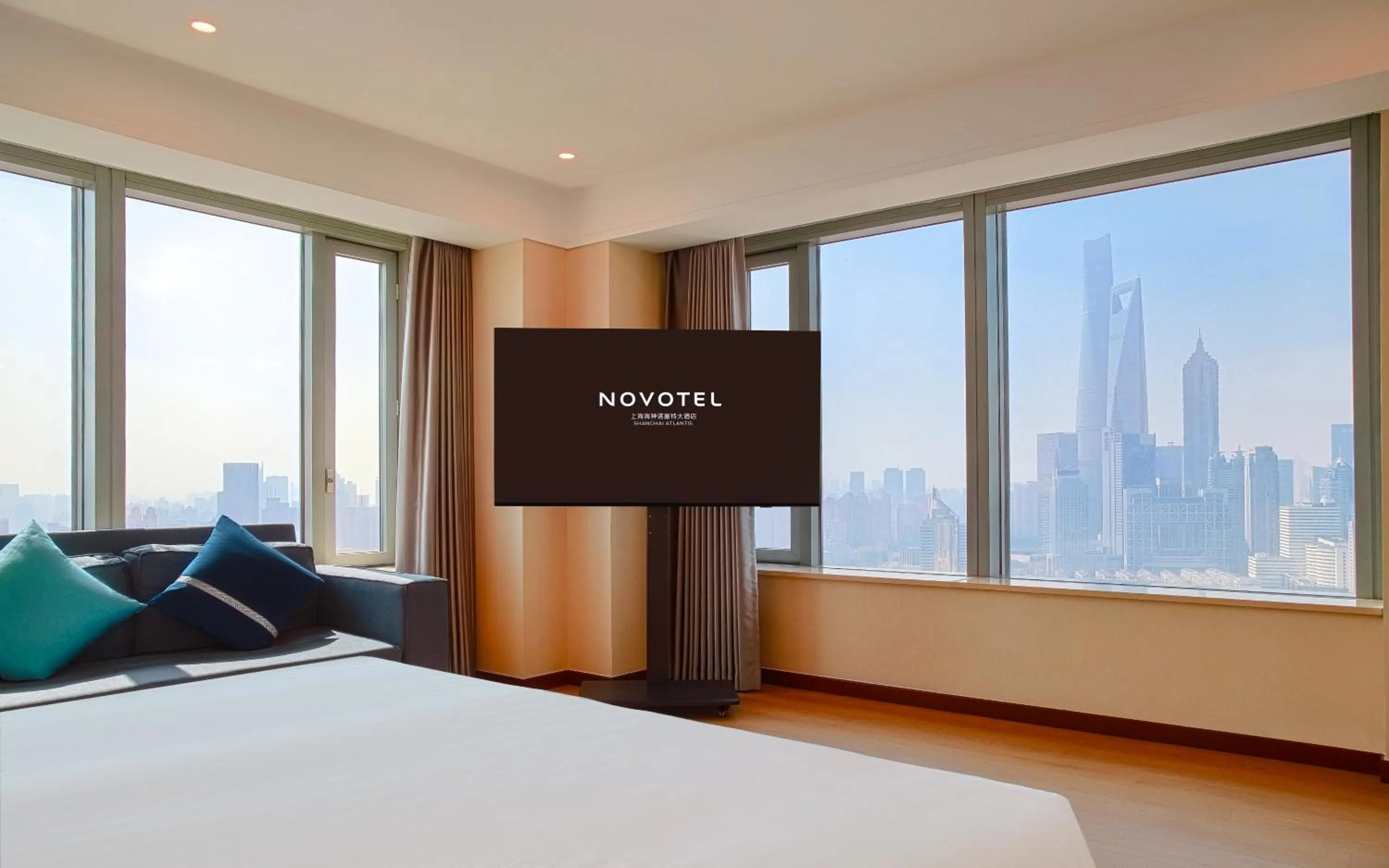 Bed in Novotel Atlantis Shanghai - Enjoy our great-valued breakfast in our rooftop revolving restaurant with a stunning river view & utilize our FREE self-serviced laundry