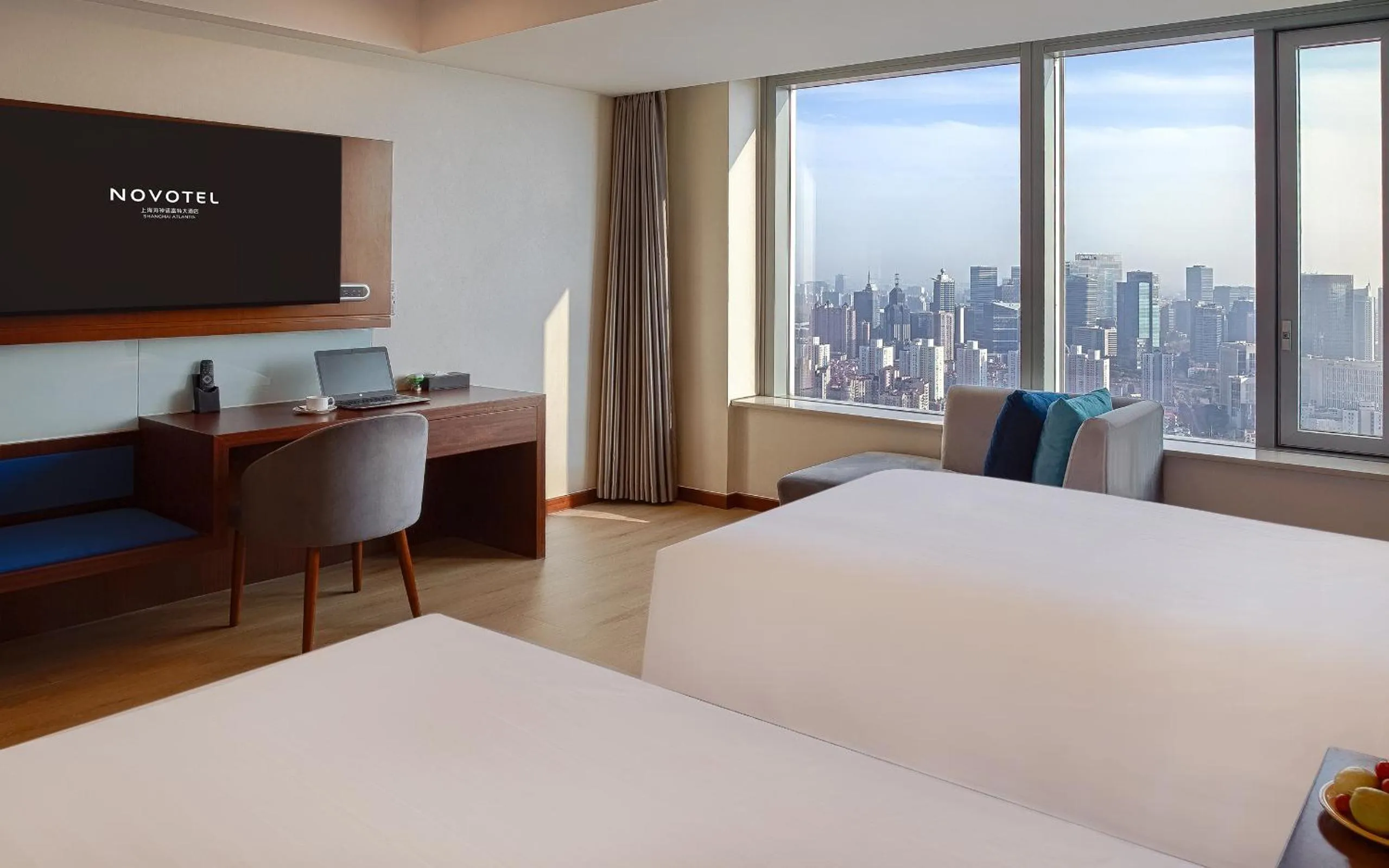Bed in Novotel Atlantis Shanghai - Enjoy our great-valued breakfast in our rooftop revolving restaurant with a stunning river view & utilize our FREE self-serviced laundry