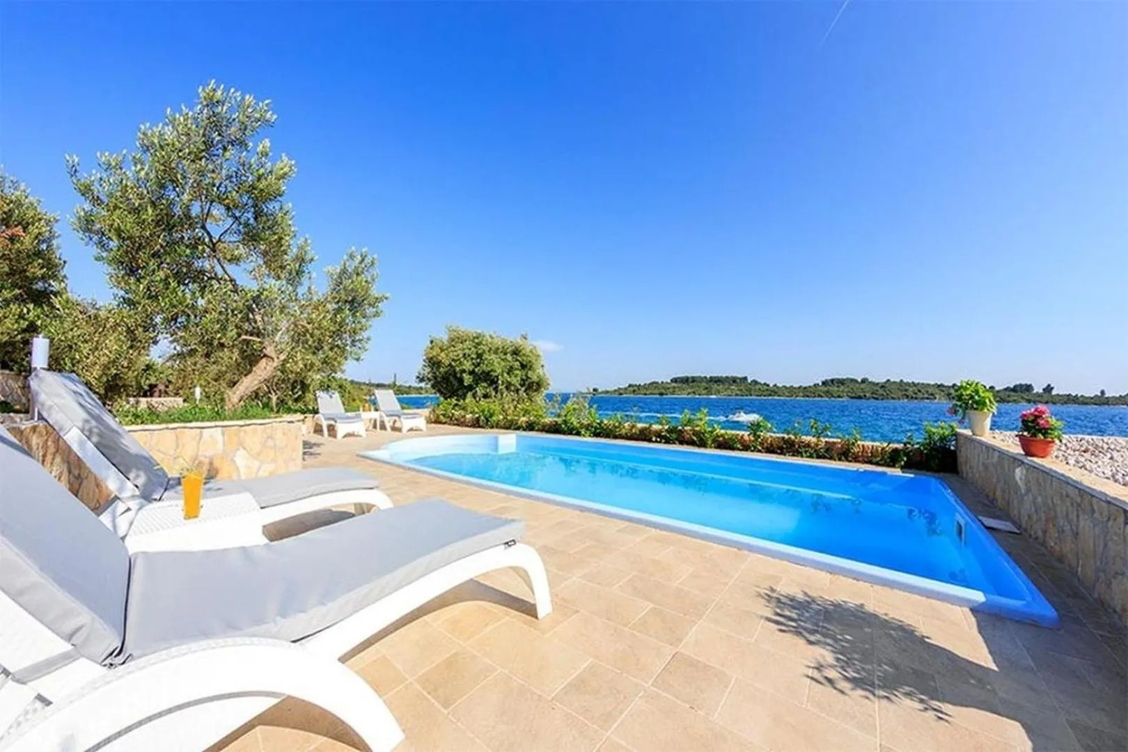 Property building in Luxury Beachfront Villa Dalmatino Trogir with private pool right at the beach in Okrug Gornji - Ciovo