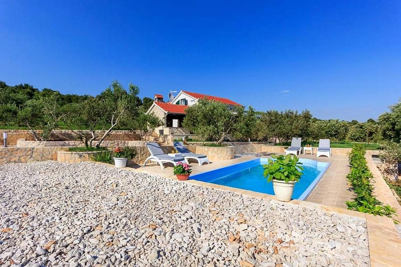 Property building in Luxury Beachfront Villa Dalmatino Trogir with private pool right at the beach in Okrug Gornji - Ciovo