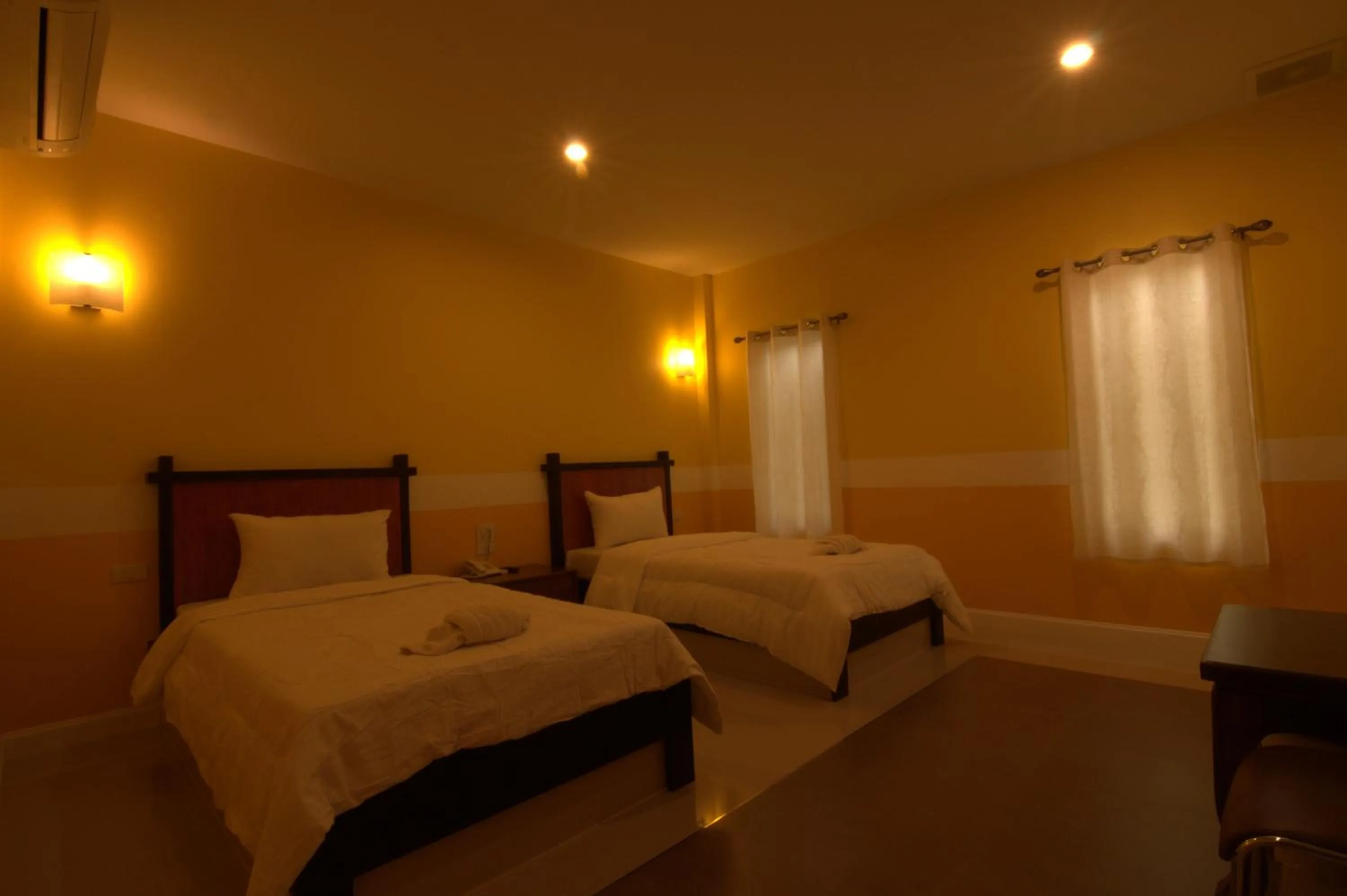 Bed in The Palm Resort Kampeang Saen