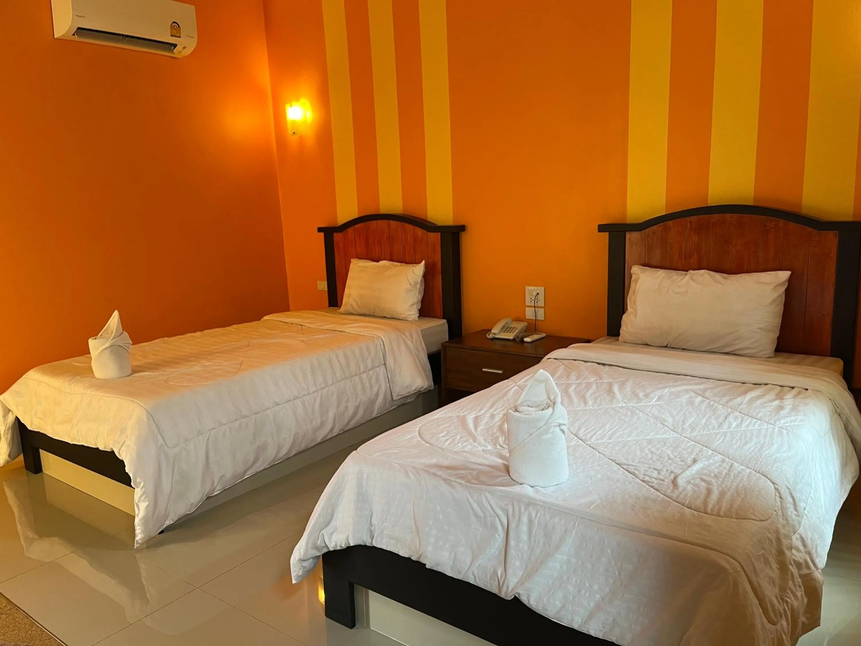 Bed in The Palm Resort Kampeang Saen