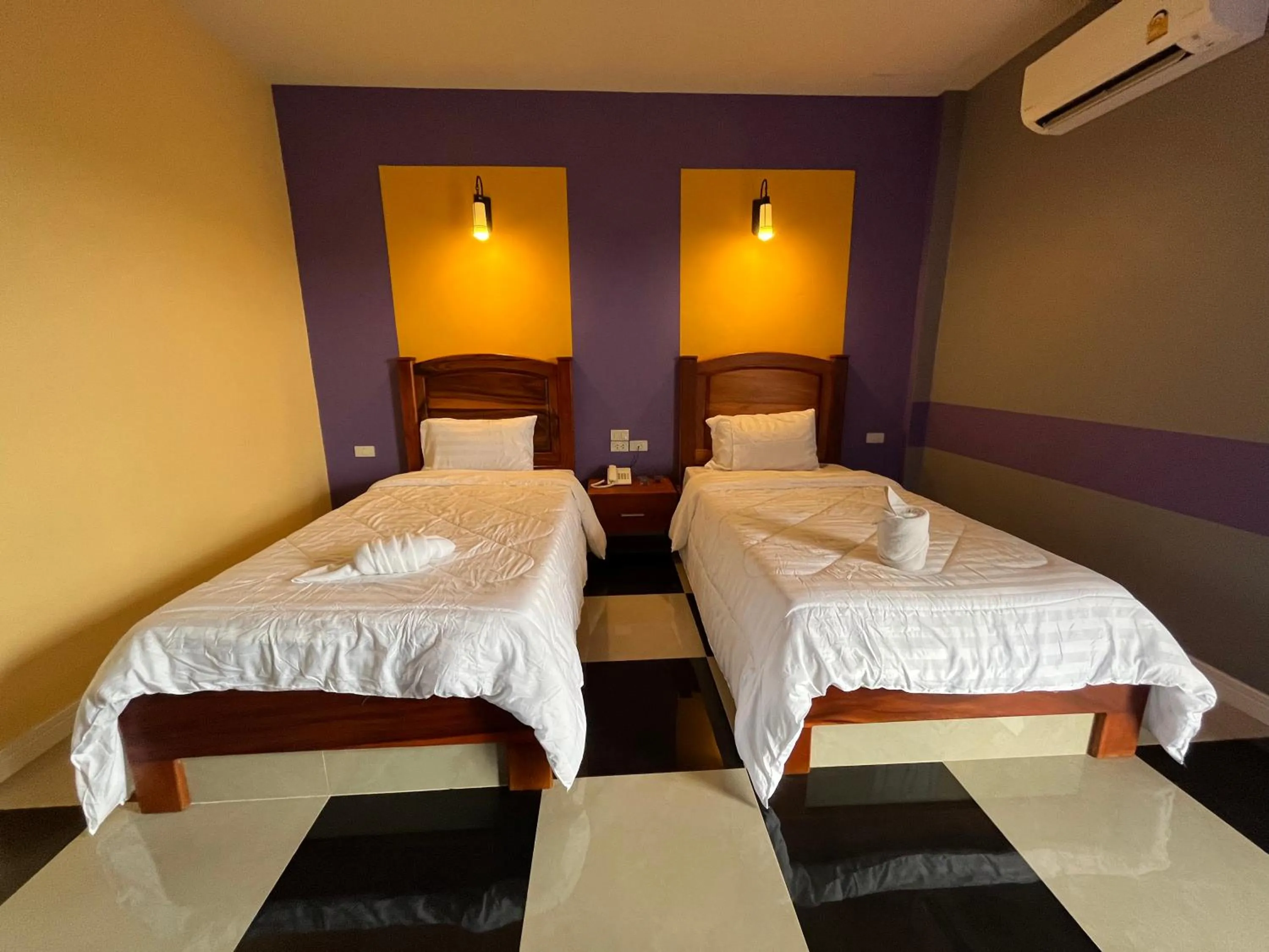 Bed in The Palm Resort Kampeang Saen