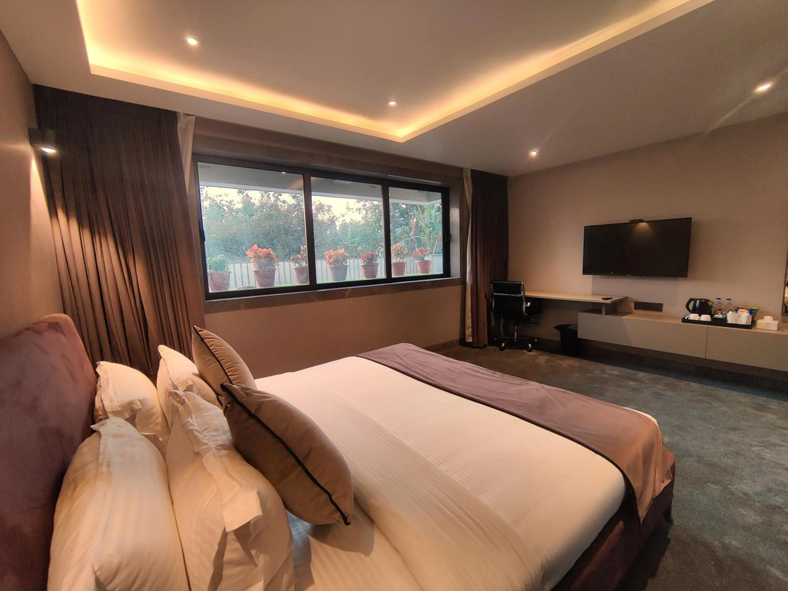 Bed in Leela Resort, The Exotic Boutique Hotel - Pure Veg