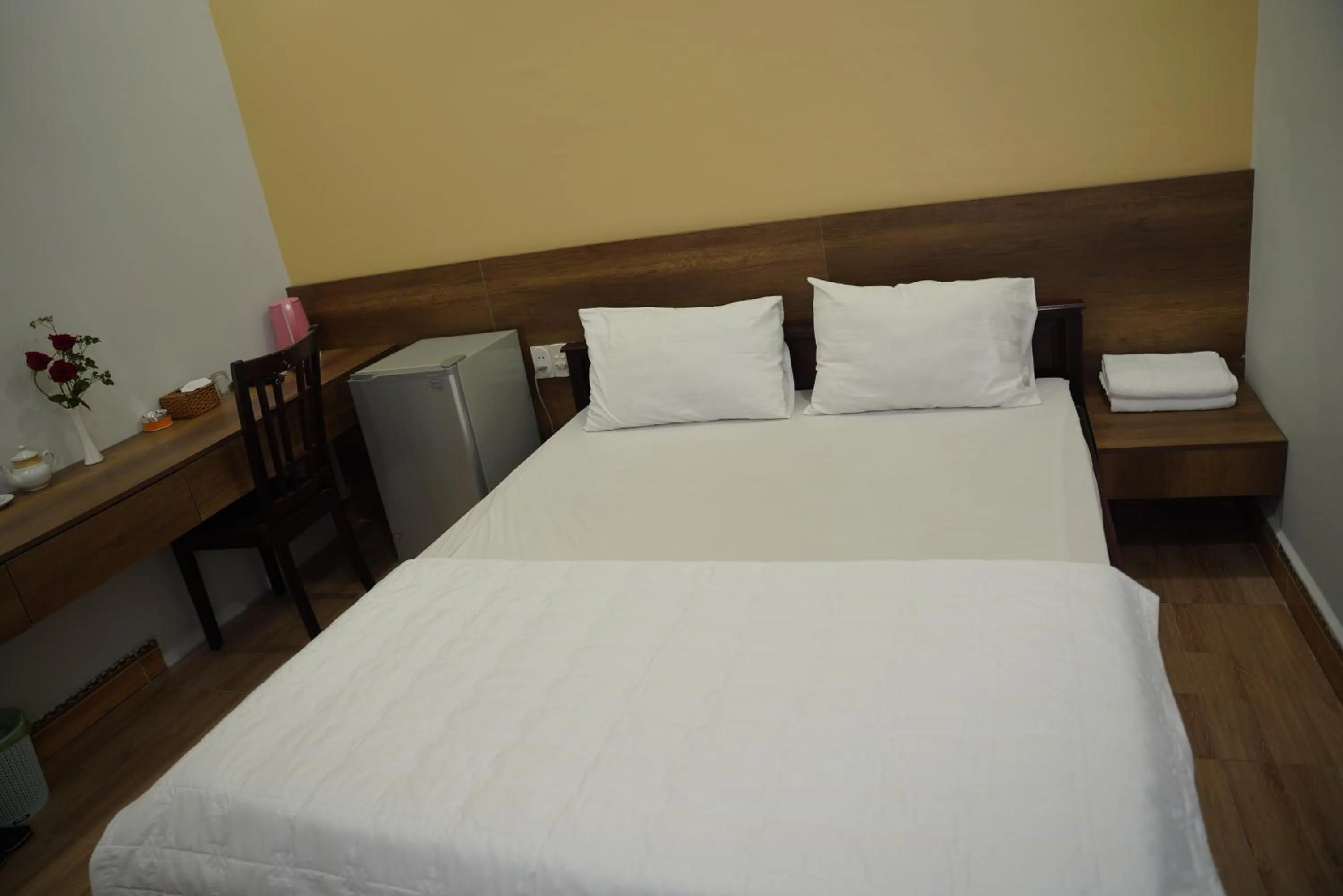 Bed in KHÁCH SẠN ĐẾ VƯƠNG