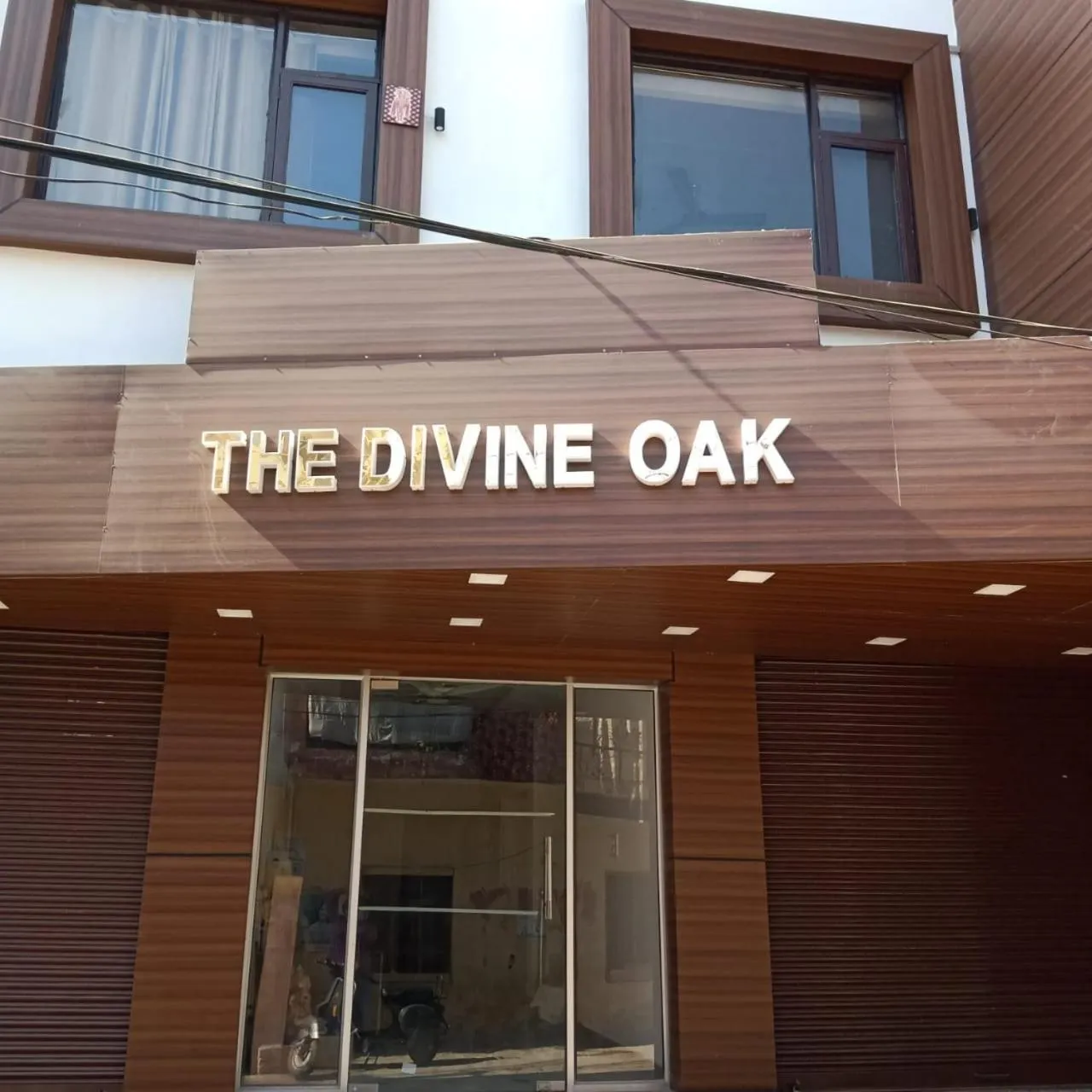Property logo or sign in The Divine Oak