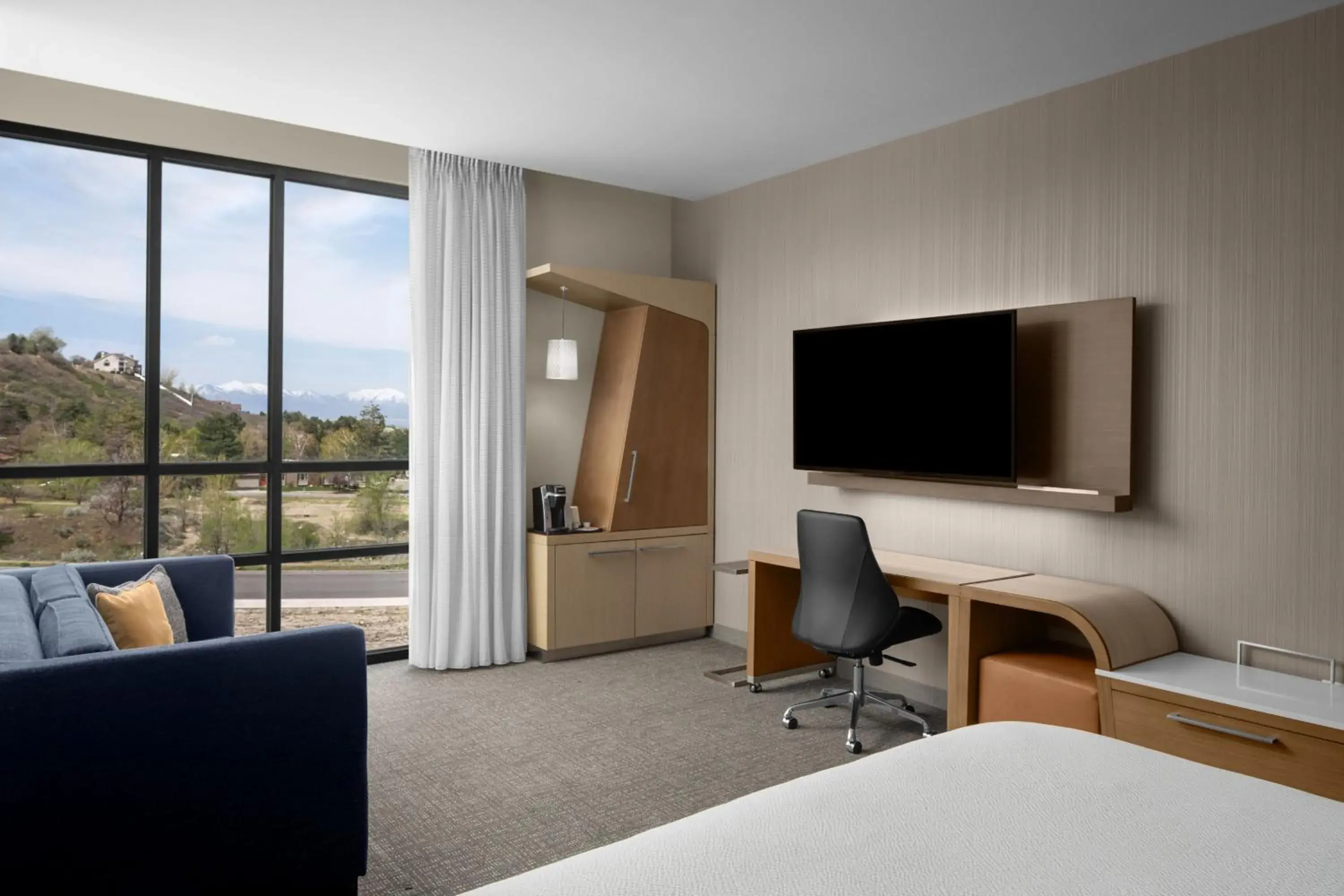 Guest room, 1 King, Sofa bed, Mountain view, Upper floor in Courtyard by Marriott Salt Lake City Cottonwood Guest room, 1 King, Sofa bed, Mountain view, Upper floor in Courtyard by Marriott Salt Lake City Cottonwood