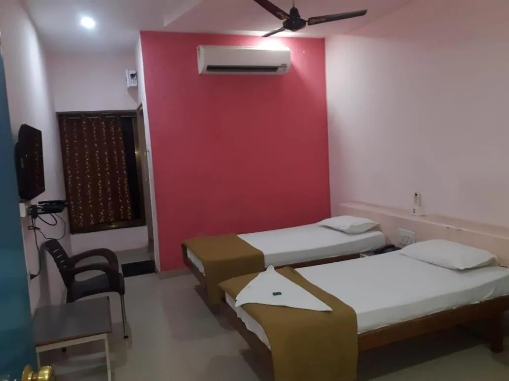 Bed in Hotel Uma Executive Lodging