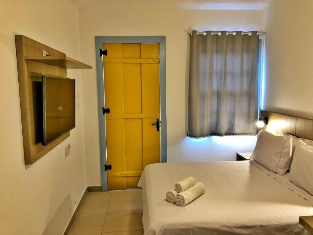 Bed in Pousada Relicário