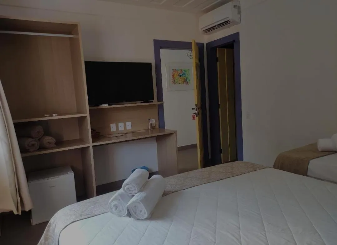 Bed in Pousada Relicário