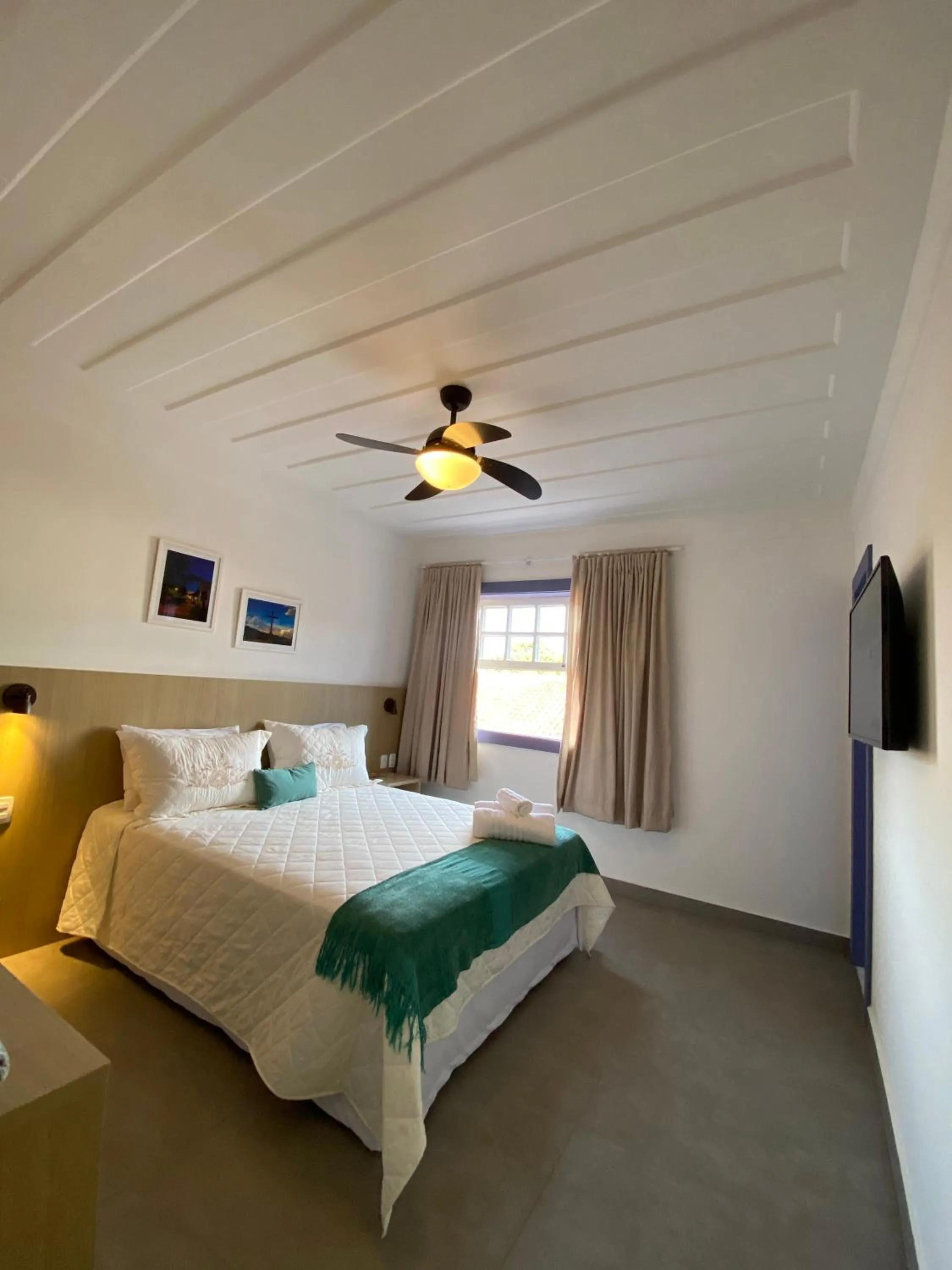 Bed in Pousada Relicário