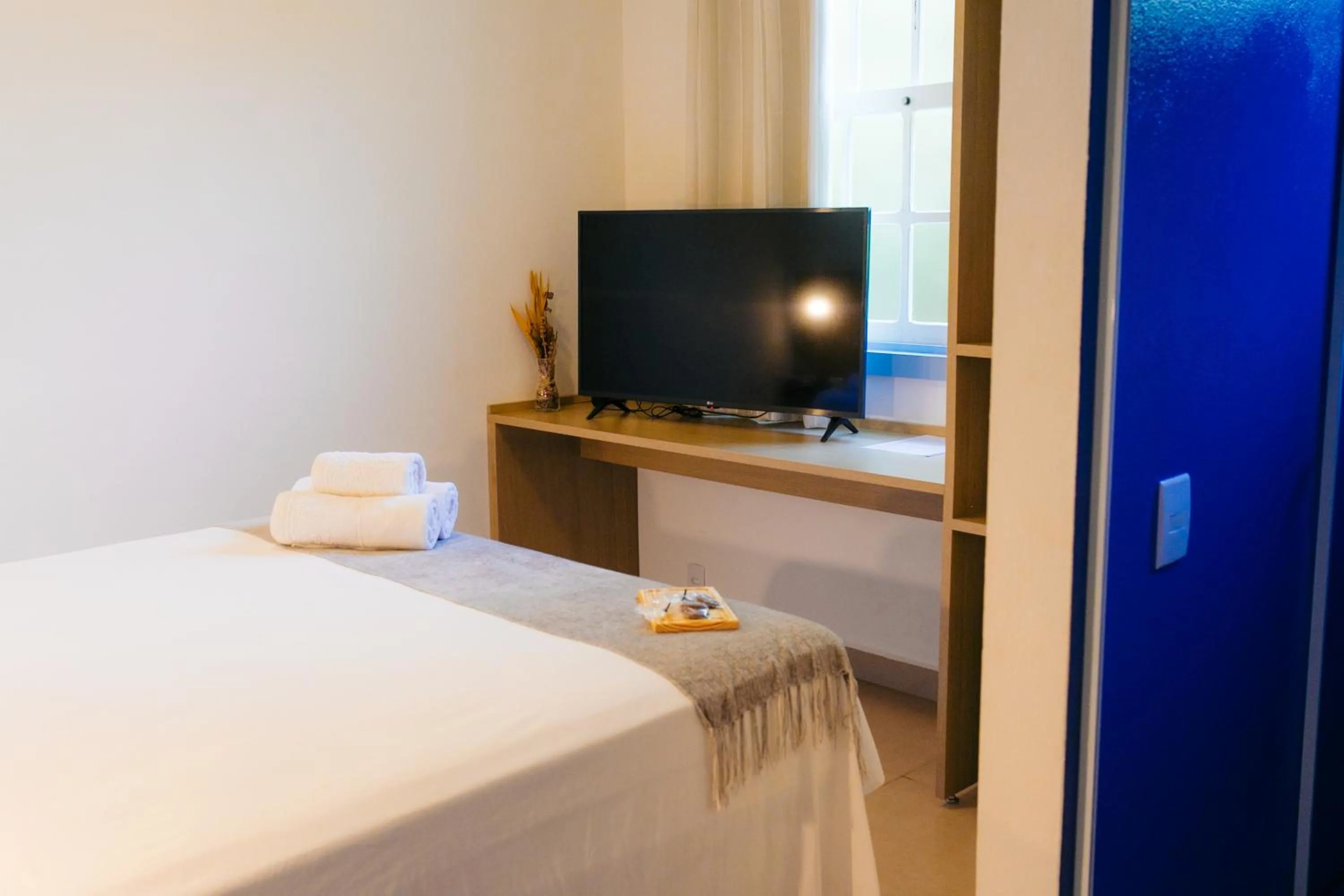 Bed in Pousada Relicário