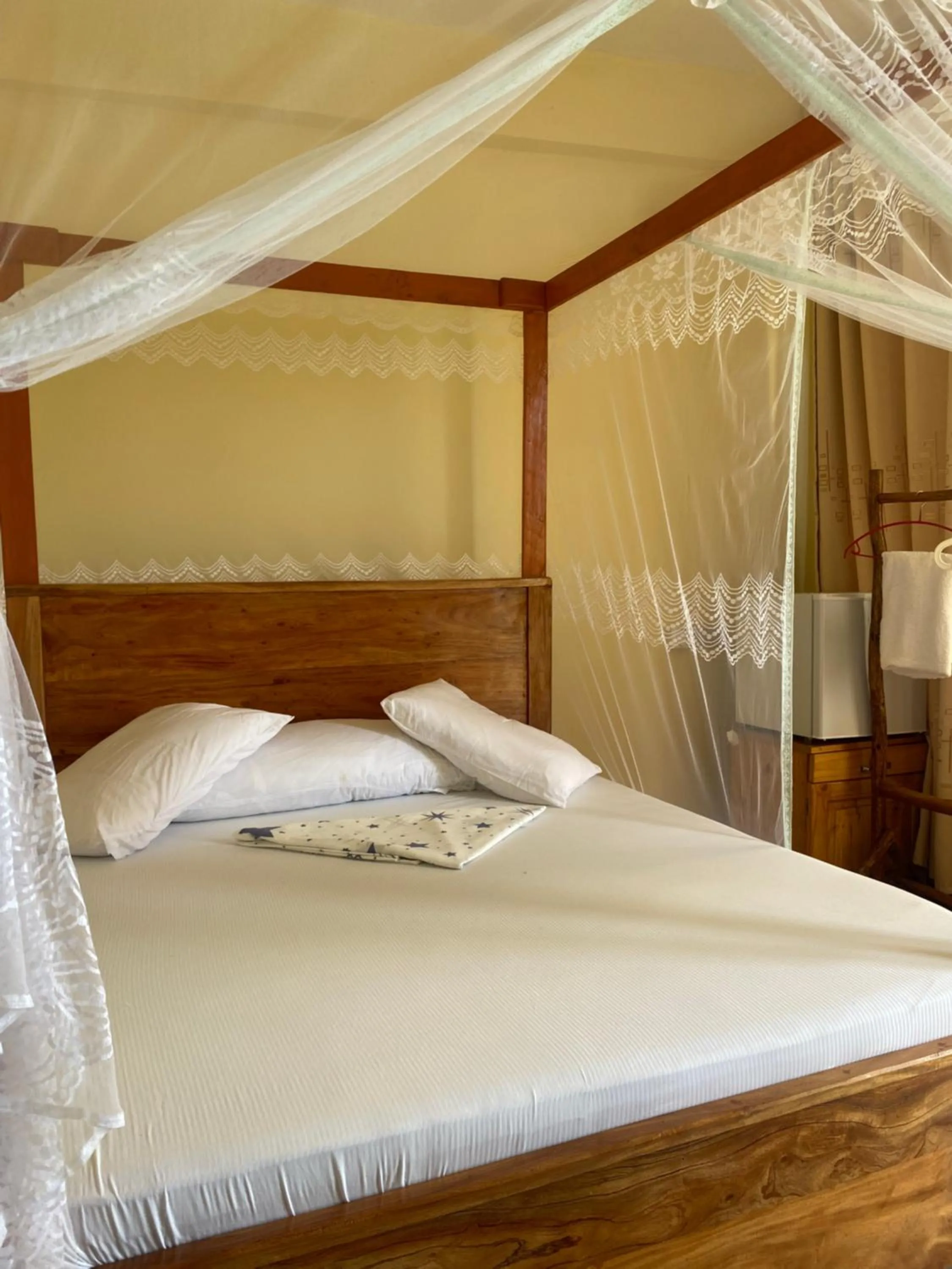 Bed in Mikoko Beach & Cottages