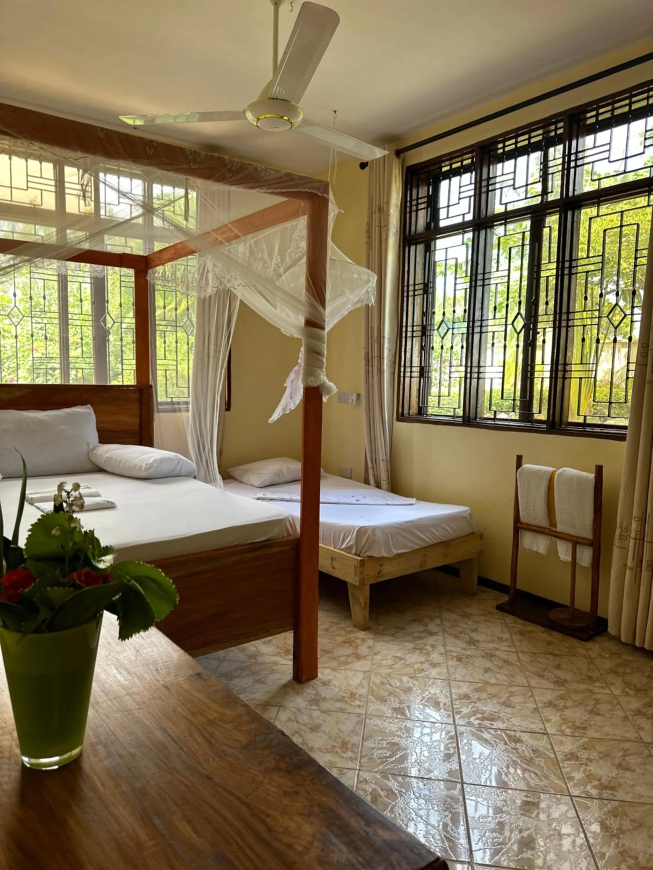 Bed in Mikoko Beach & Cottages