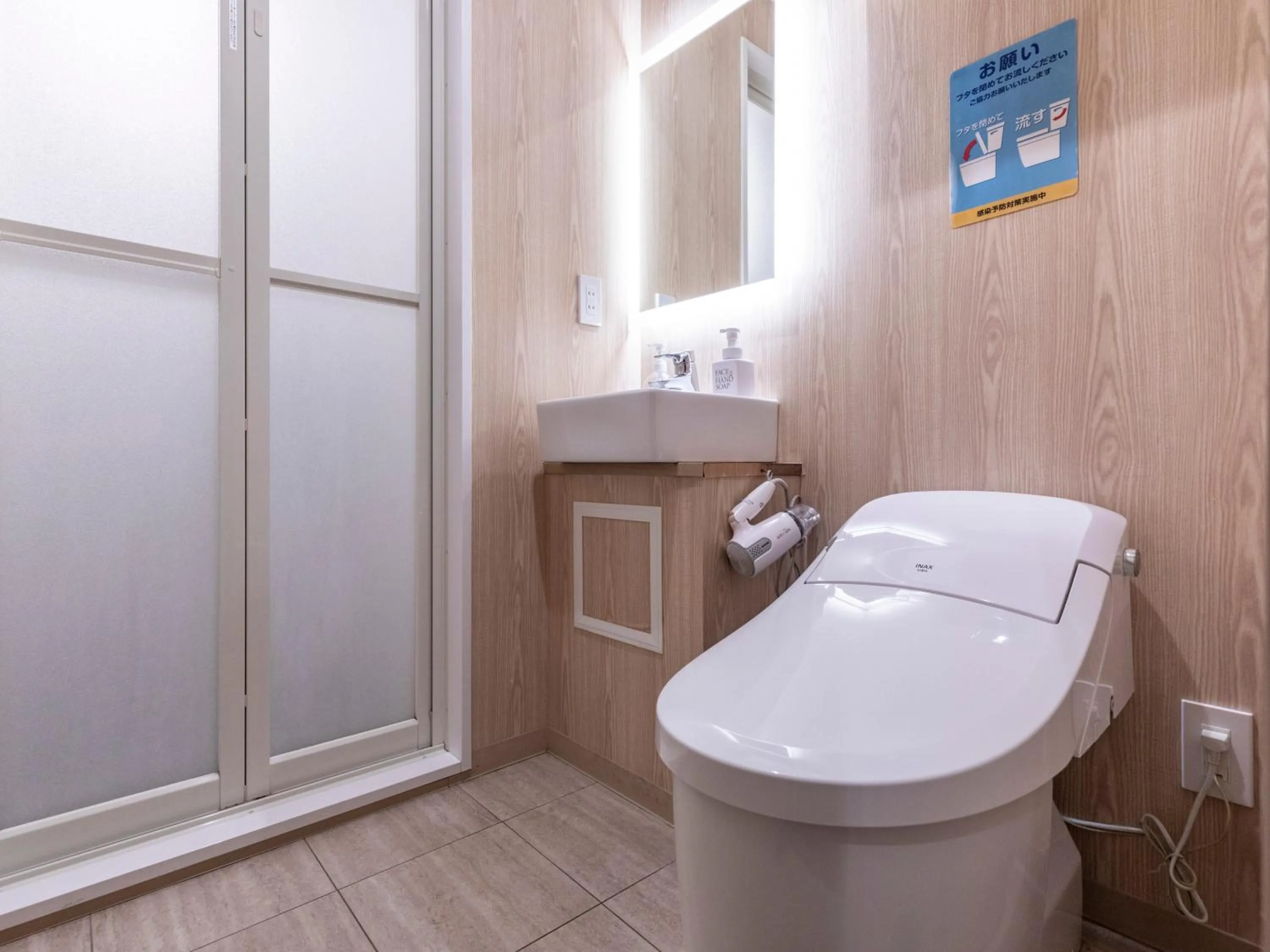 Toilet in Trust Hotel