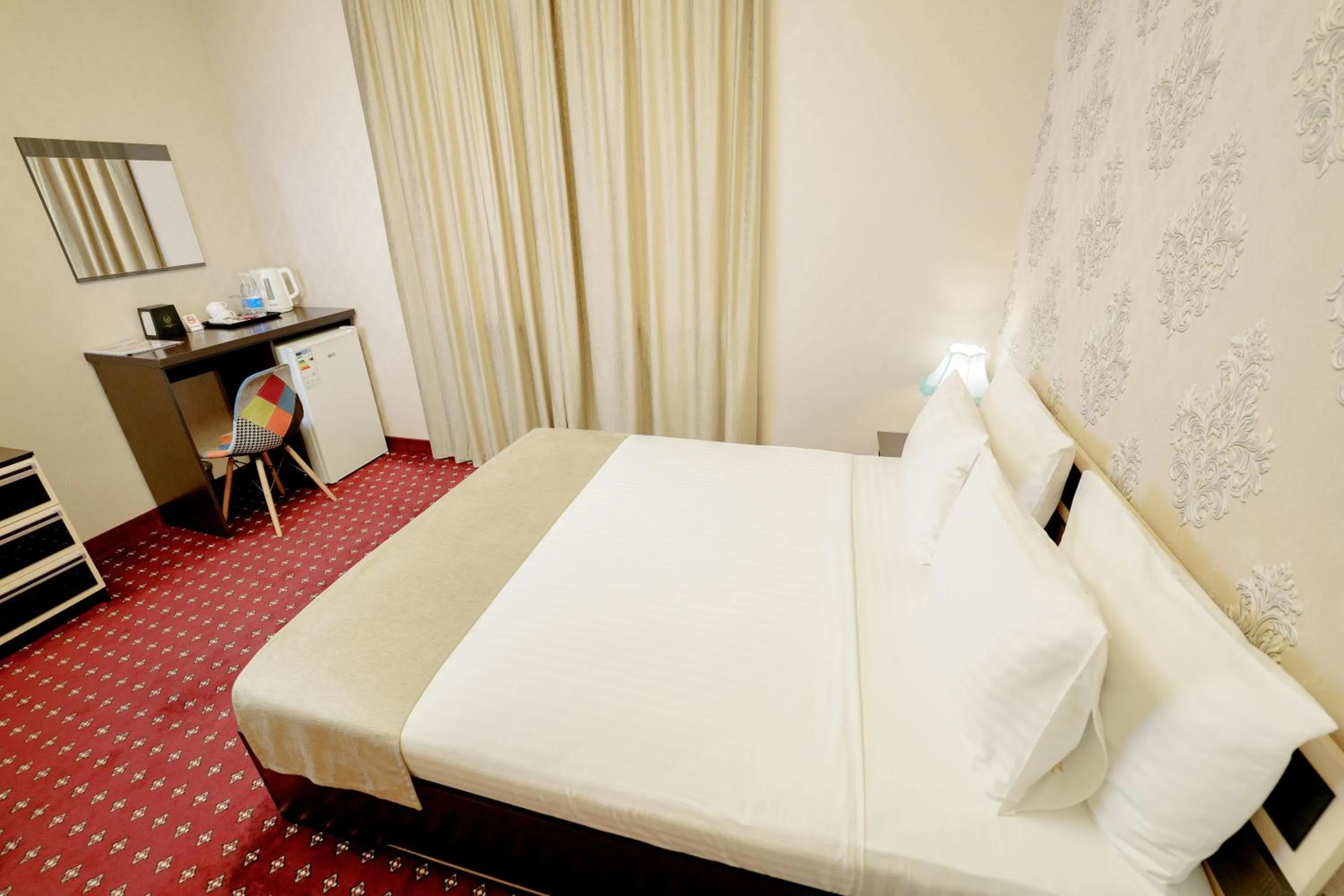 Bed in Welcome Inn Hotel