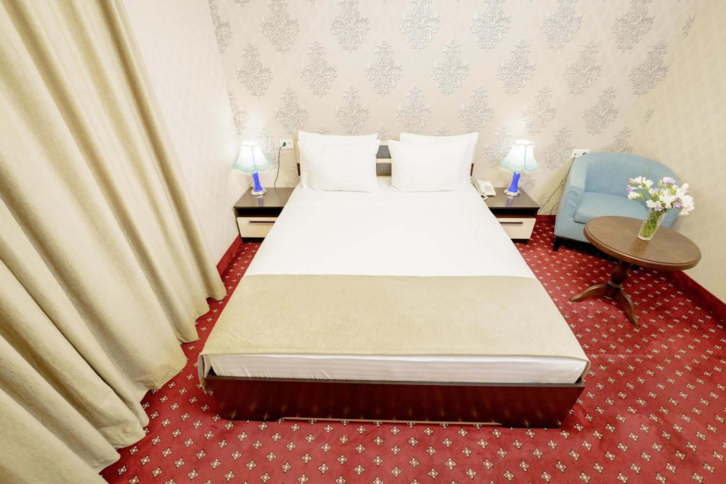 Bed in Welcome Inn Hotel