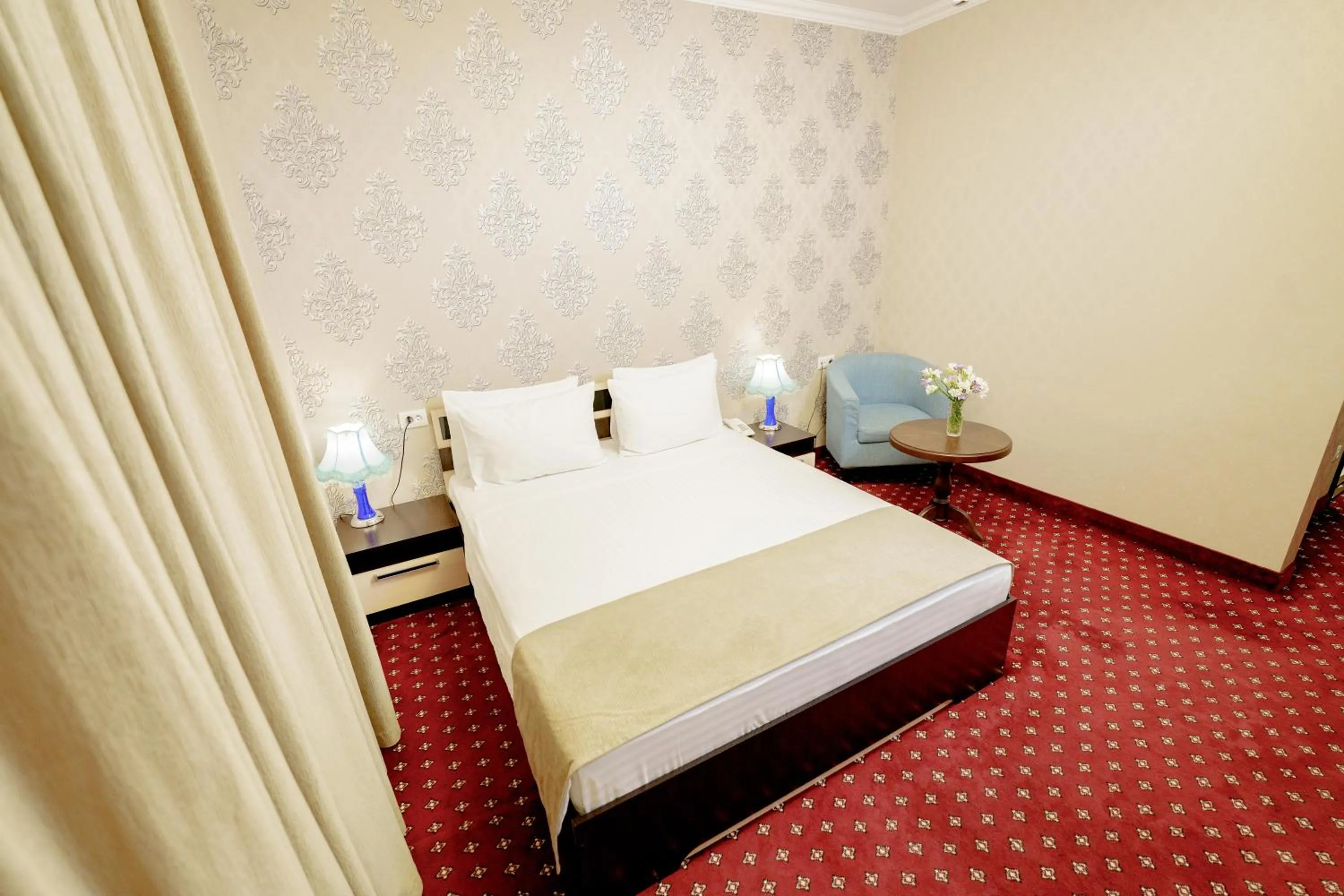 Bed in Welcome Inn Hotel