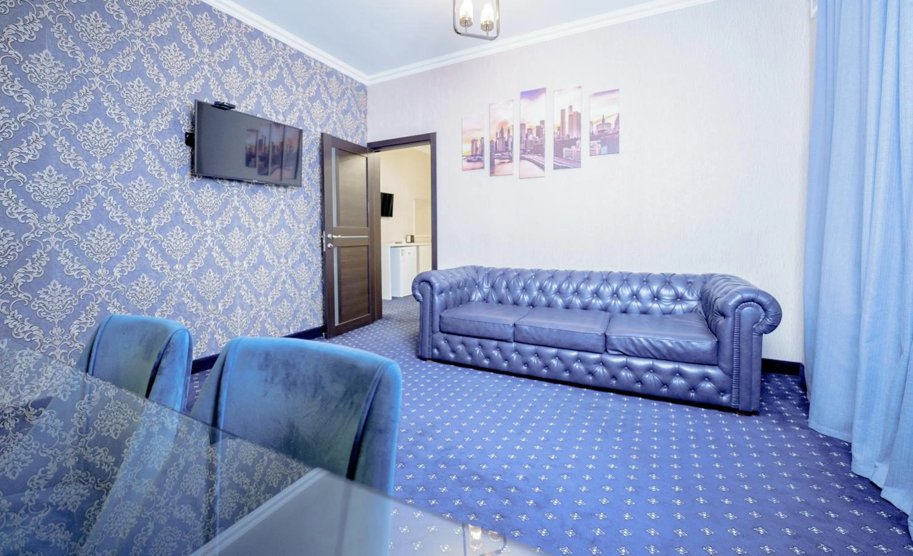 Living room in Welcome Inn Hotel