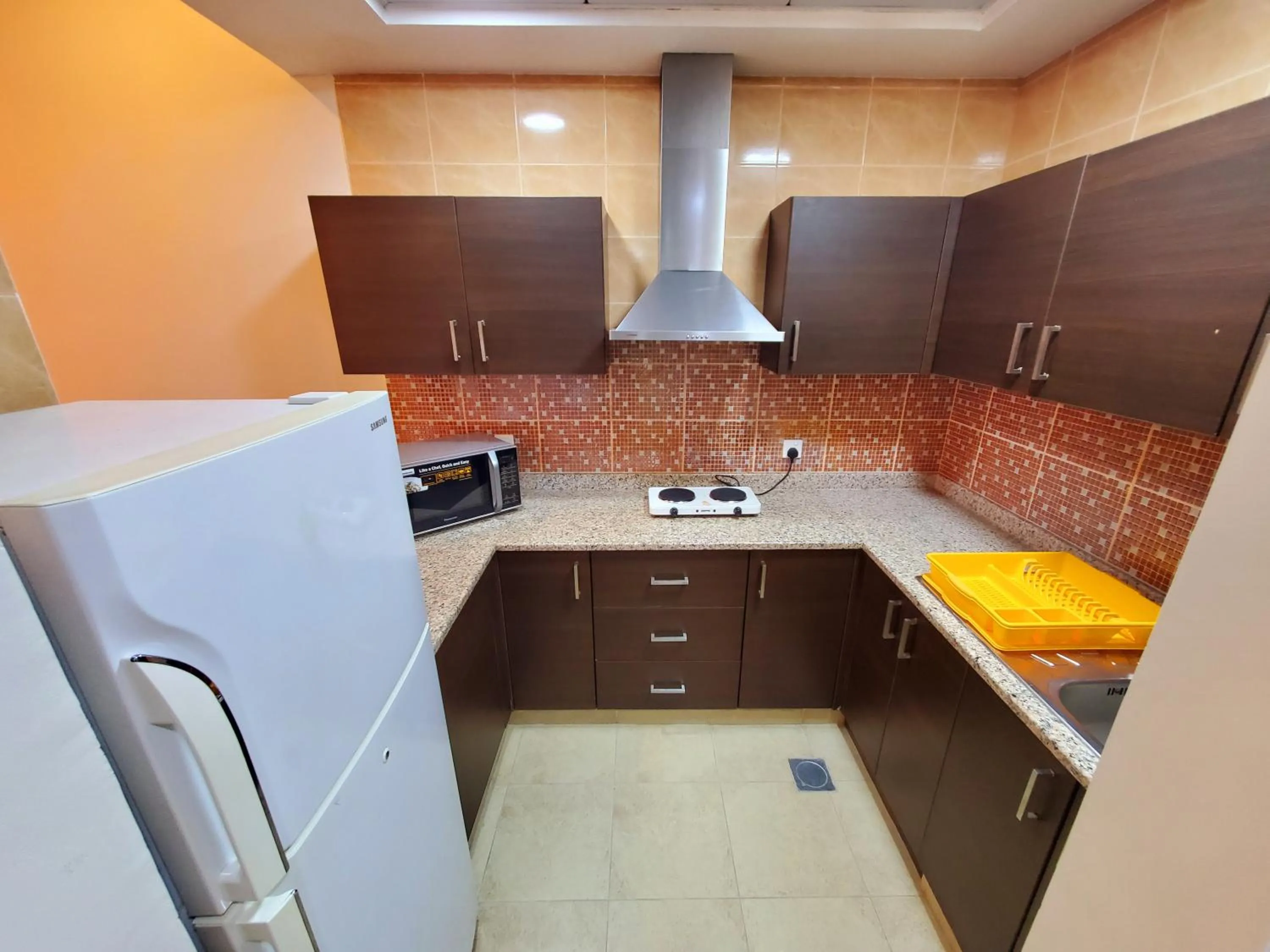 Kitchen or kitchenette in Skylark Hotel Apartments AL Barsha