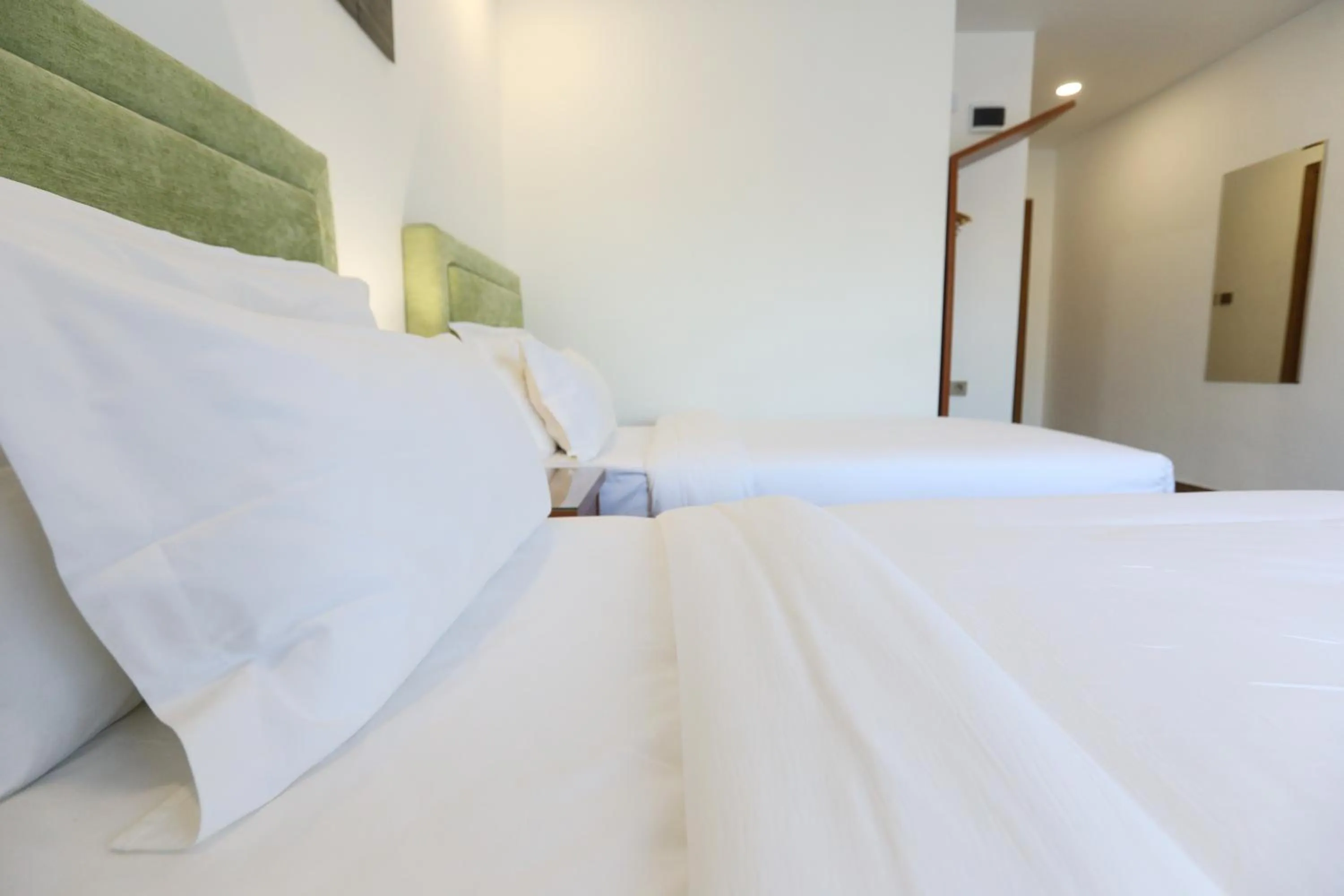 Bed in Sunrise Hotel