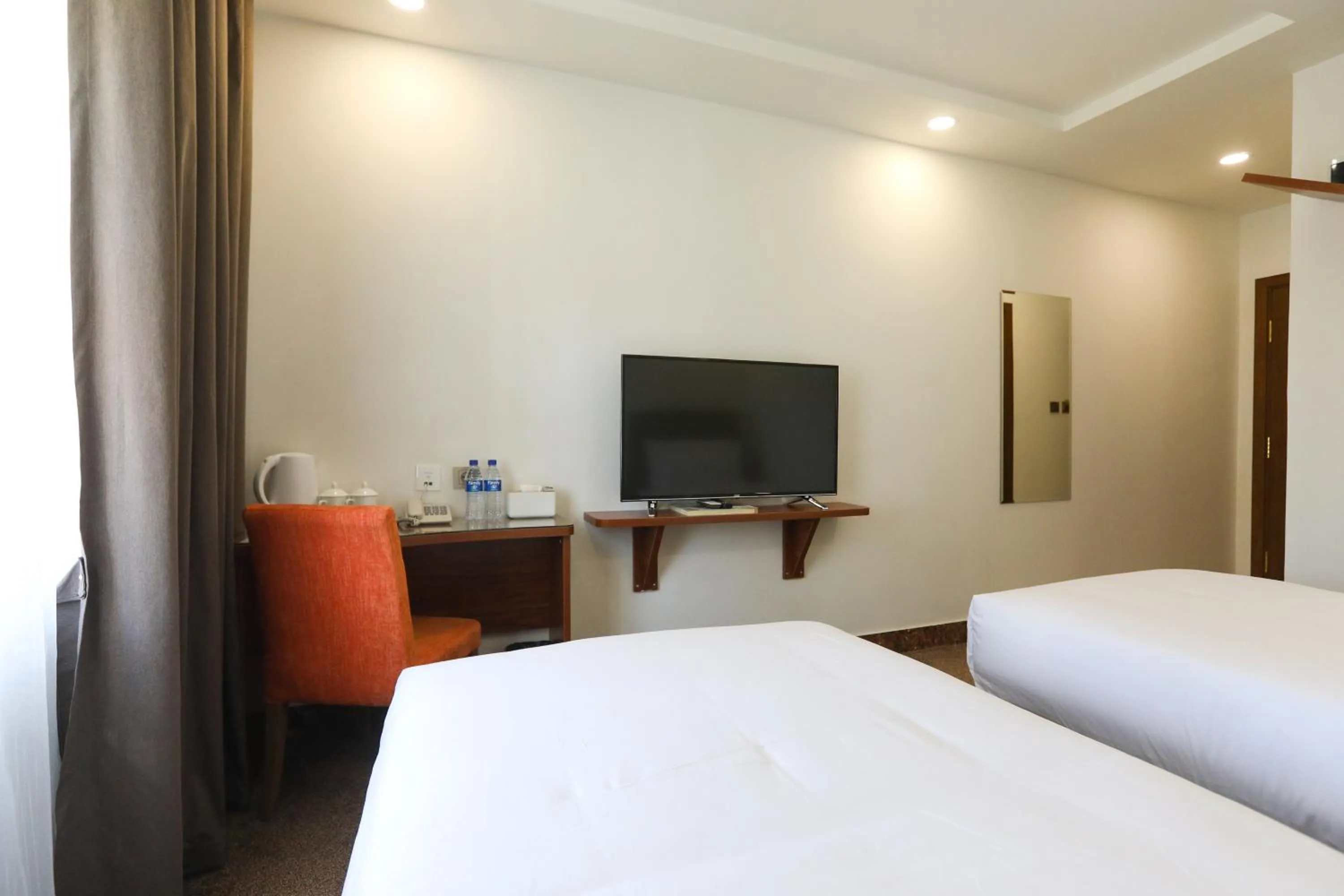 Bed in Sunrise Hotel