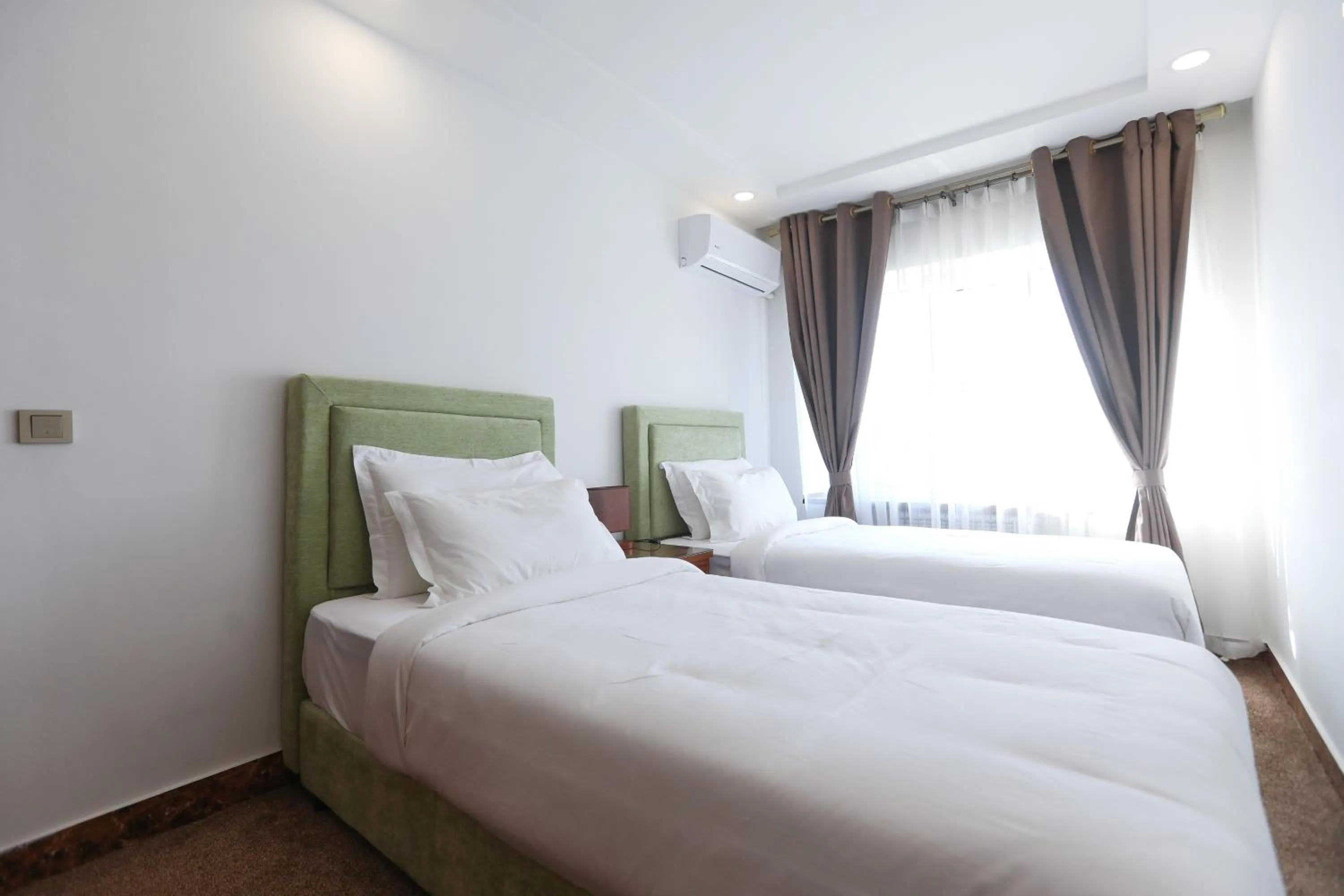 Bed in Sunrise Hotel