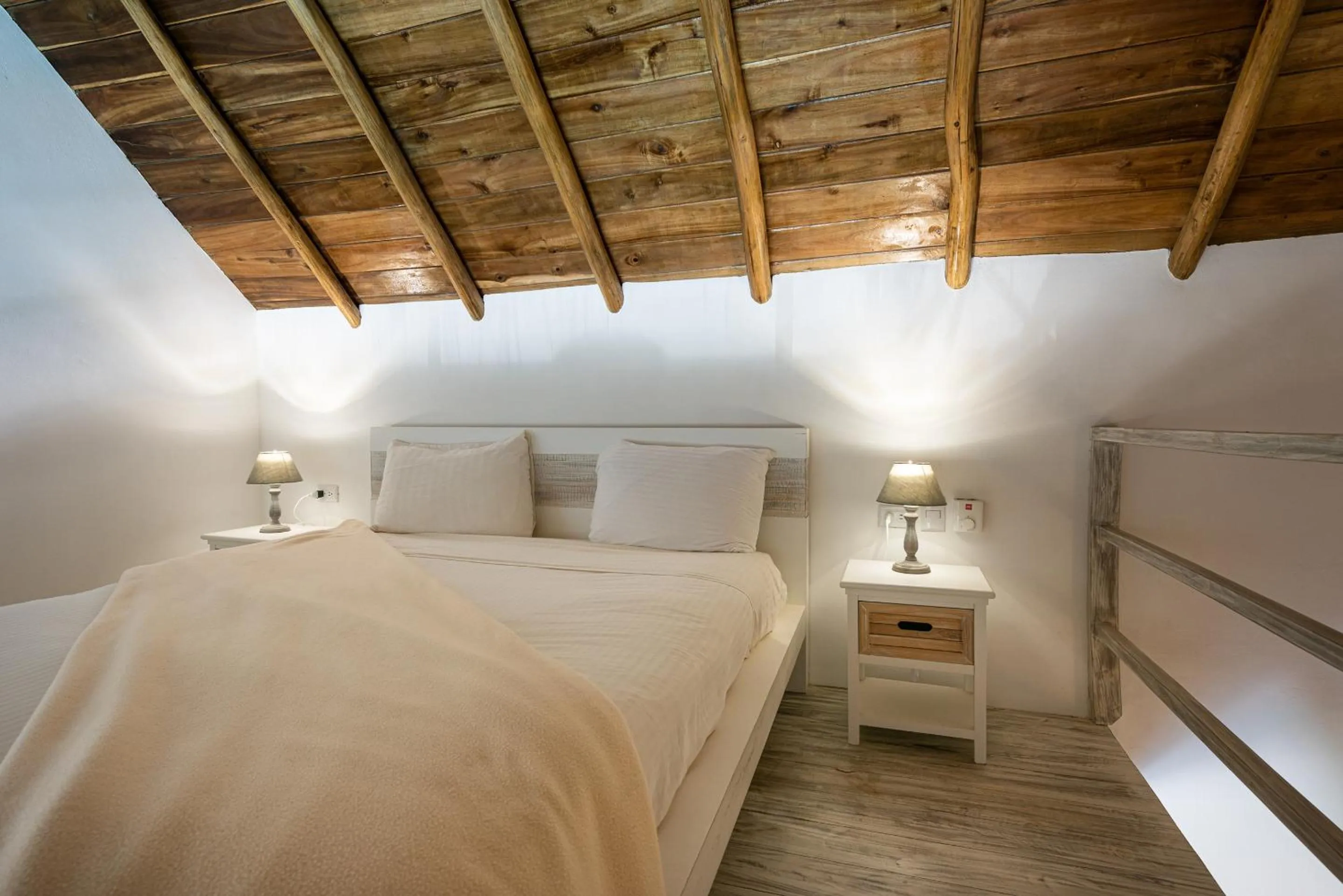 Bed in TAKUMA BOUTIK HOTEL