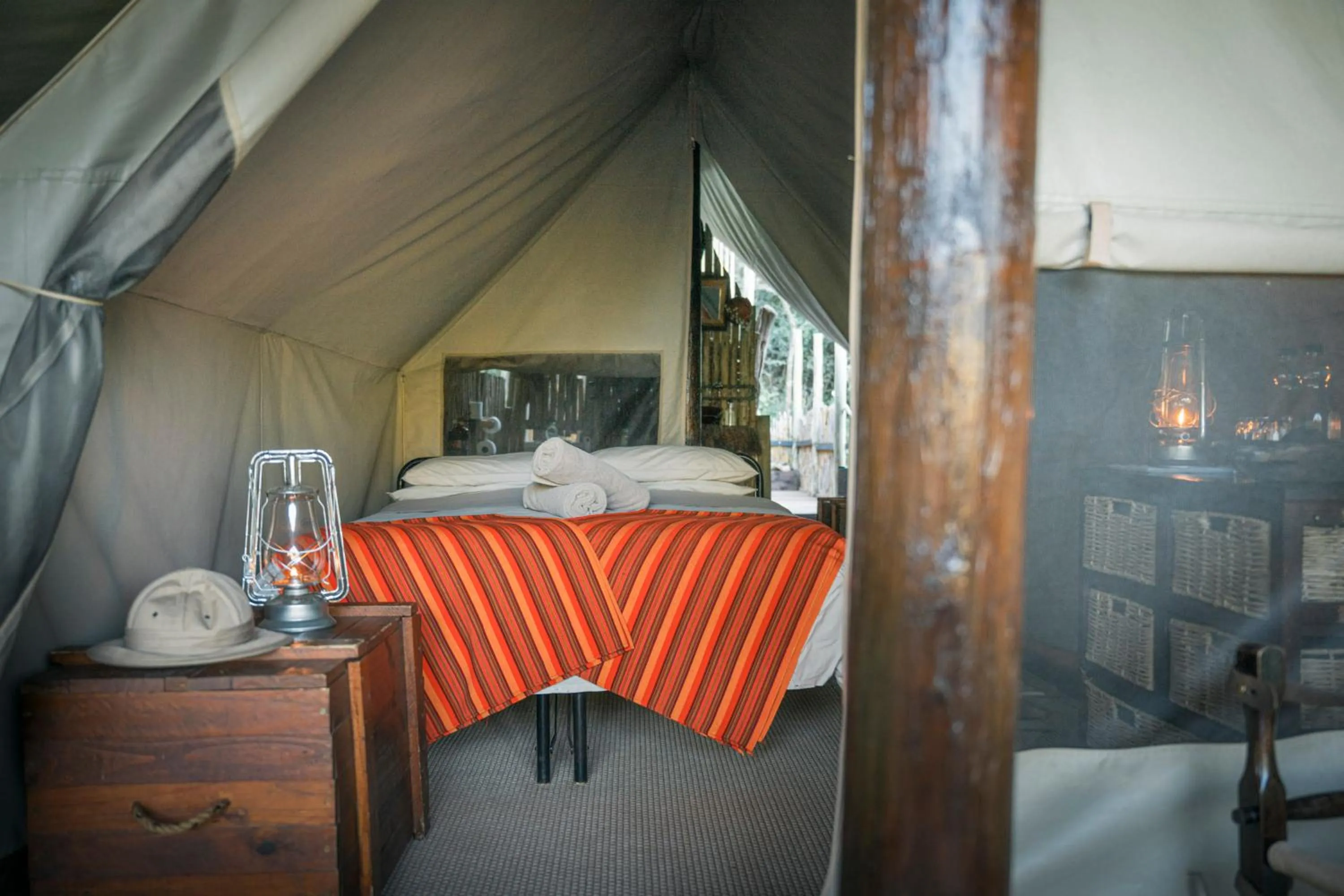Bedroom in Quatermain's 1920's Safari Camp – Amakhala Game Reserve