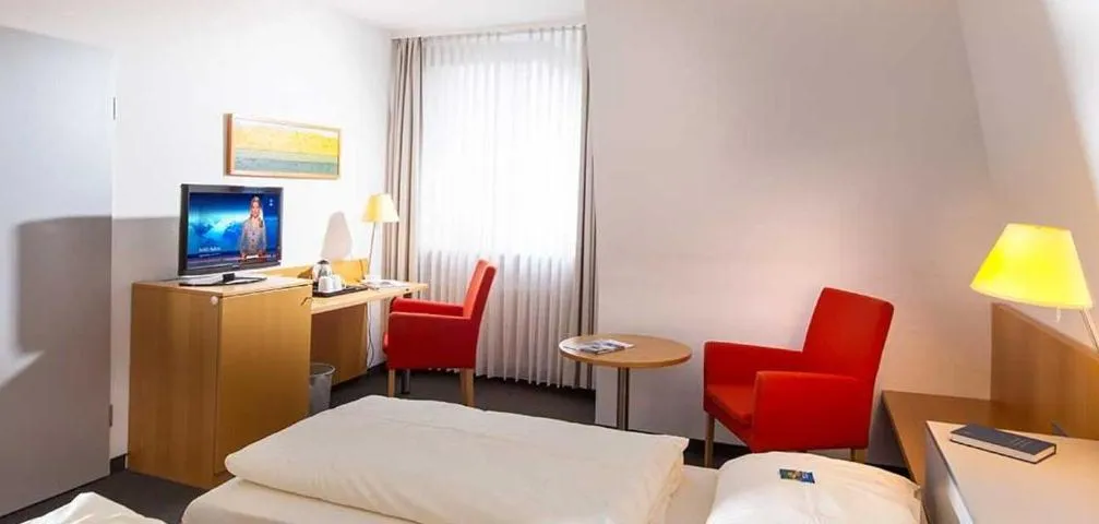 Bed, TV/Entertainment Center in Hotel Spenerhaus