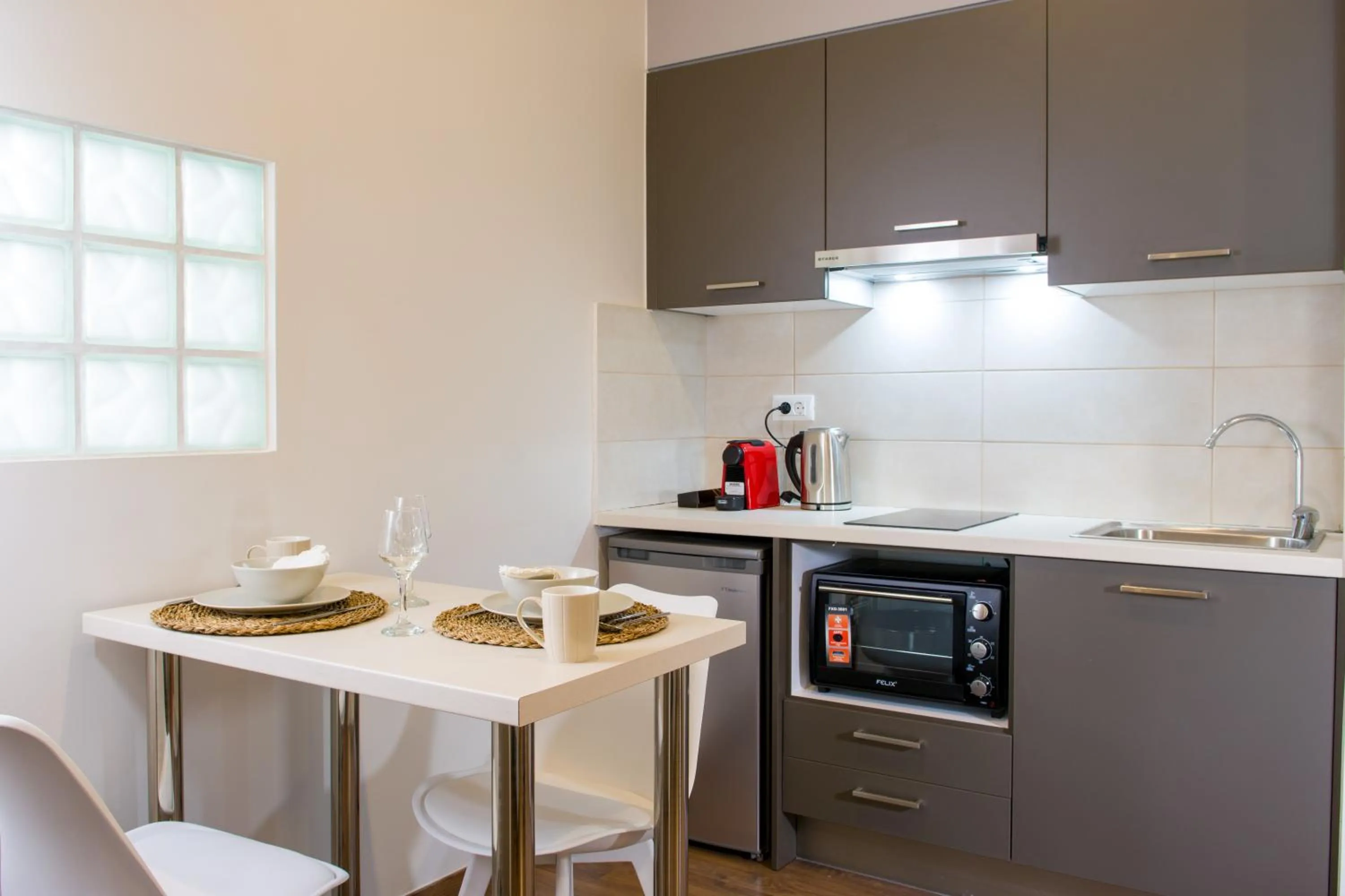 Kitchen or kitchenette in Elounda Colour Apartments