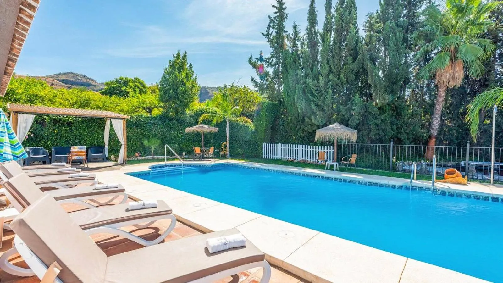Swimming pool in Casa La Vina del Arenal Pizarra by Ruralidays
