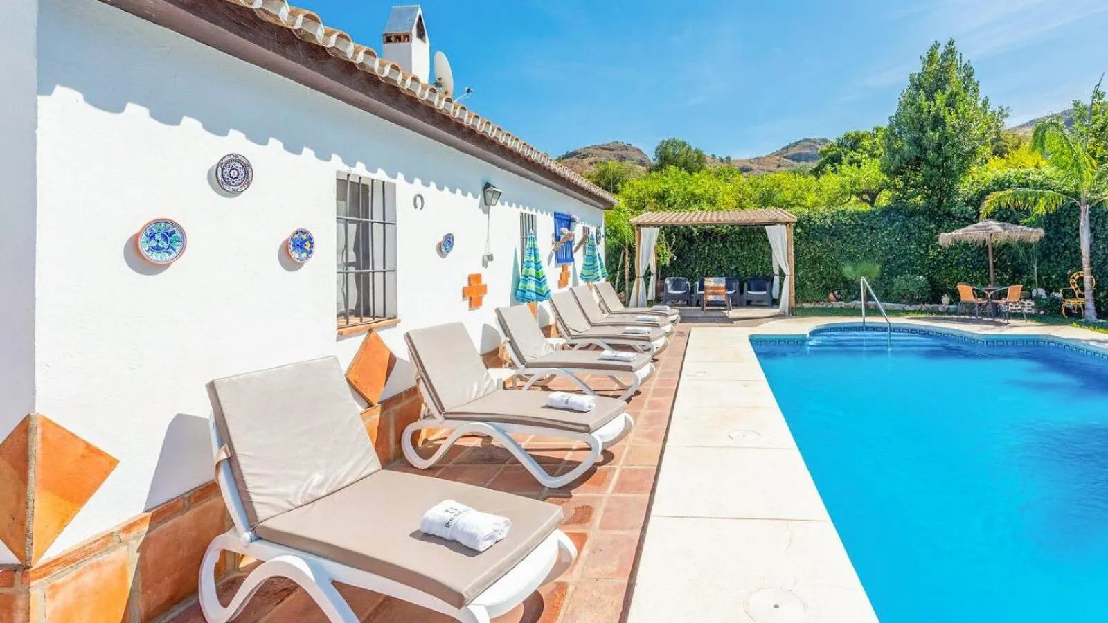 Swimming pool in Casa La Vina del Arenal Pizarra by Ruralidays