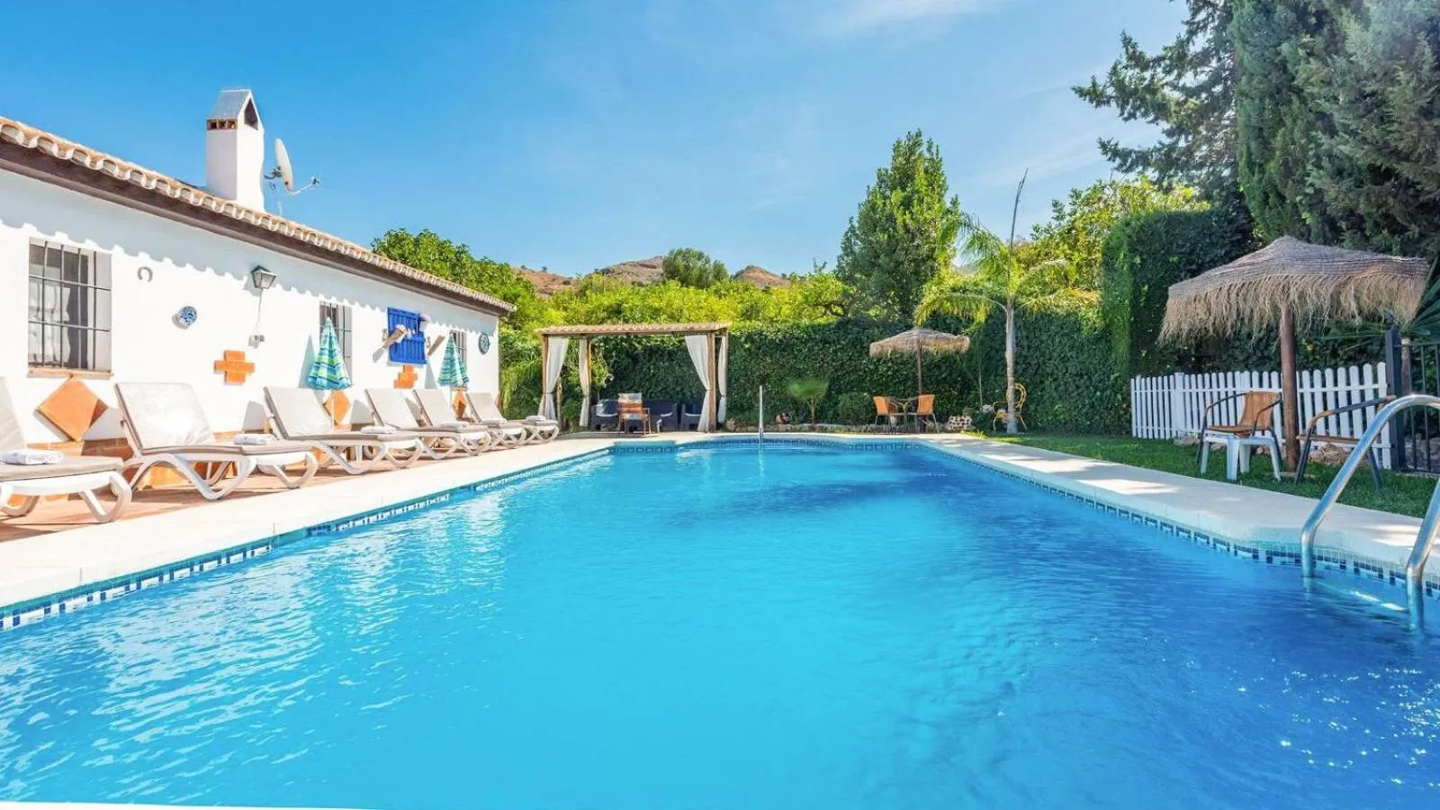 Swimming pool in Casa La Vina del Arenal Pizarra by Ruralidays