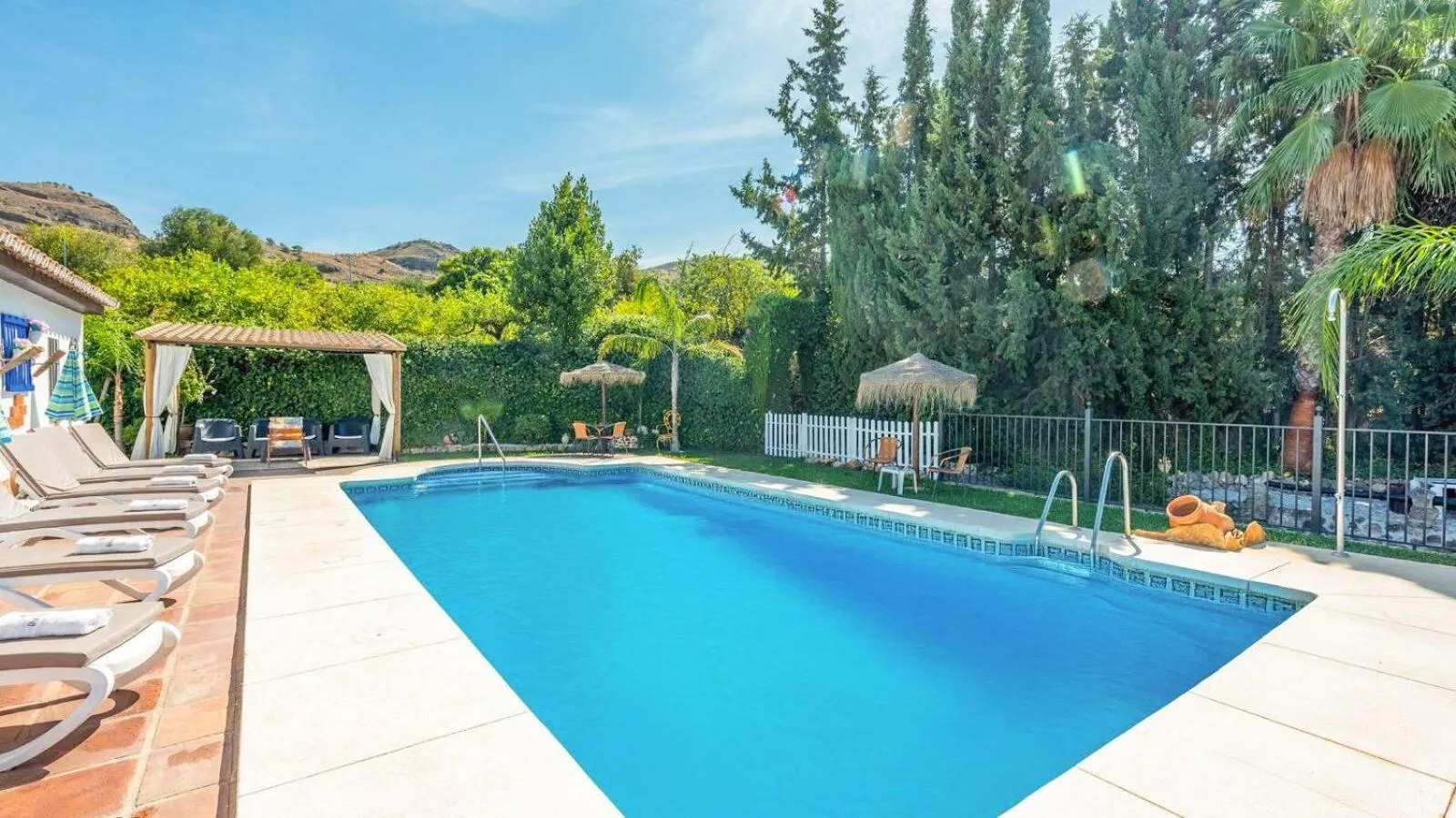 Swimming pool in Casa La Vina del Arenal Pizarra by Ruralidays