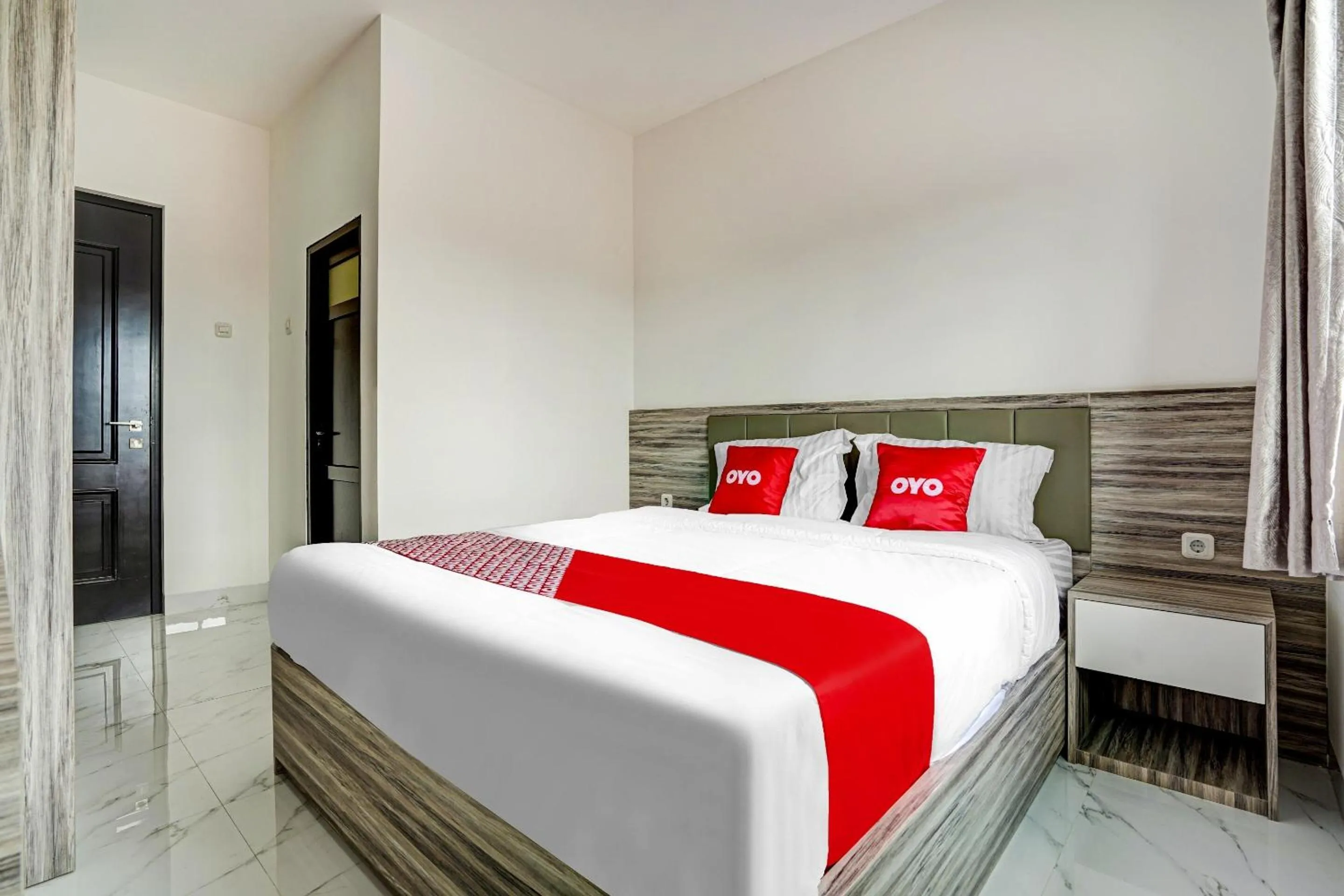 Bedroom in OYO Capital O 90164 La'rissa Residence