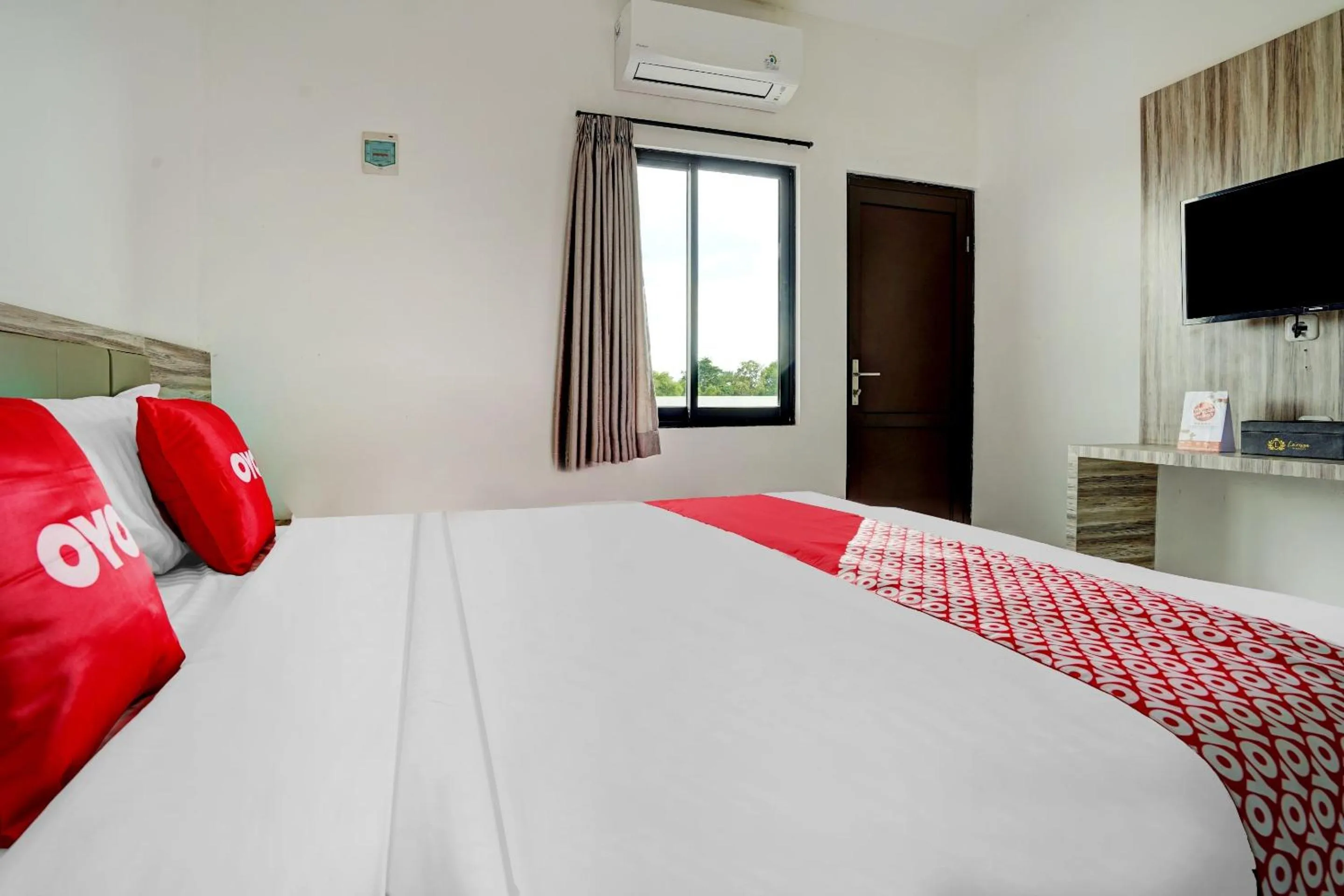 Bedroom in OYO Capital O 90164 La'rissa Residence