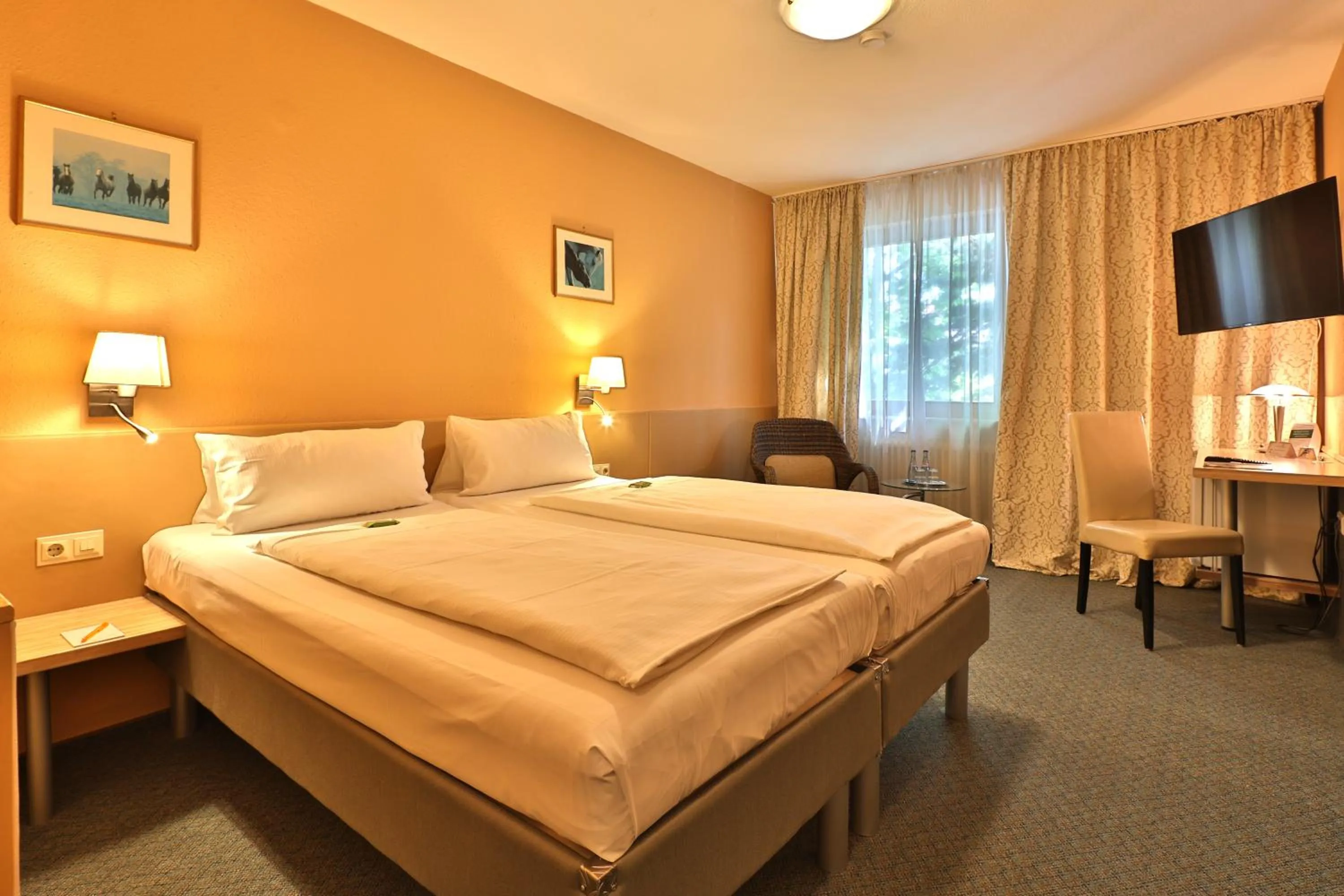 Bed in Aparthotel Deutschmeister