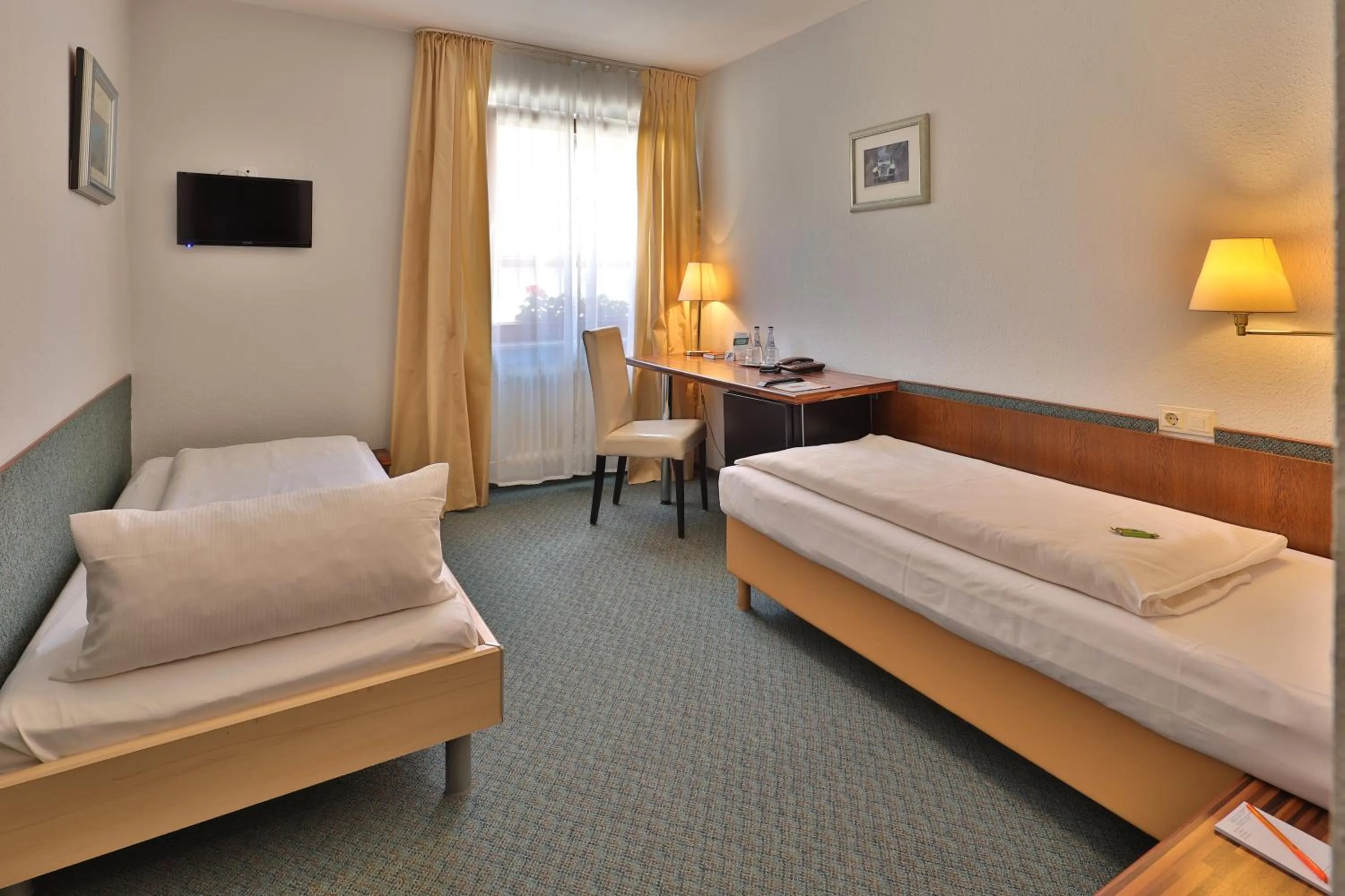 Bed in Aparthotel Deutschmeister