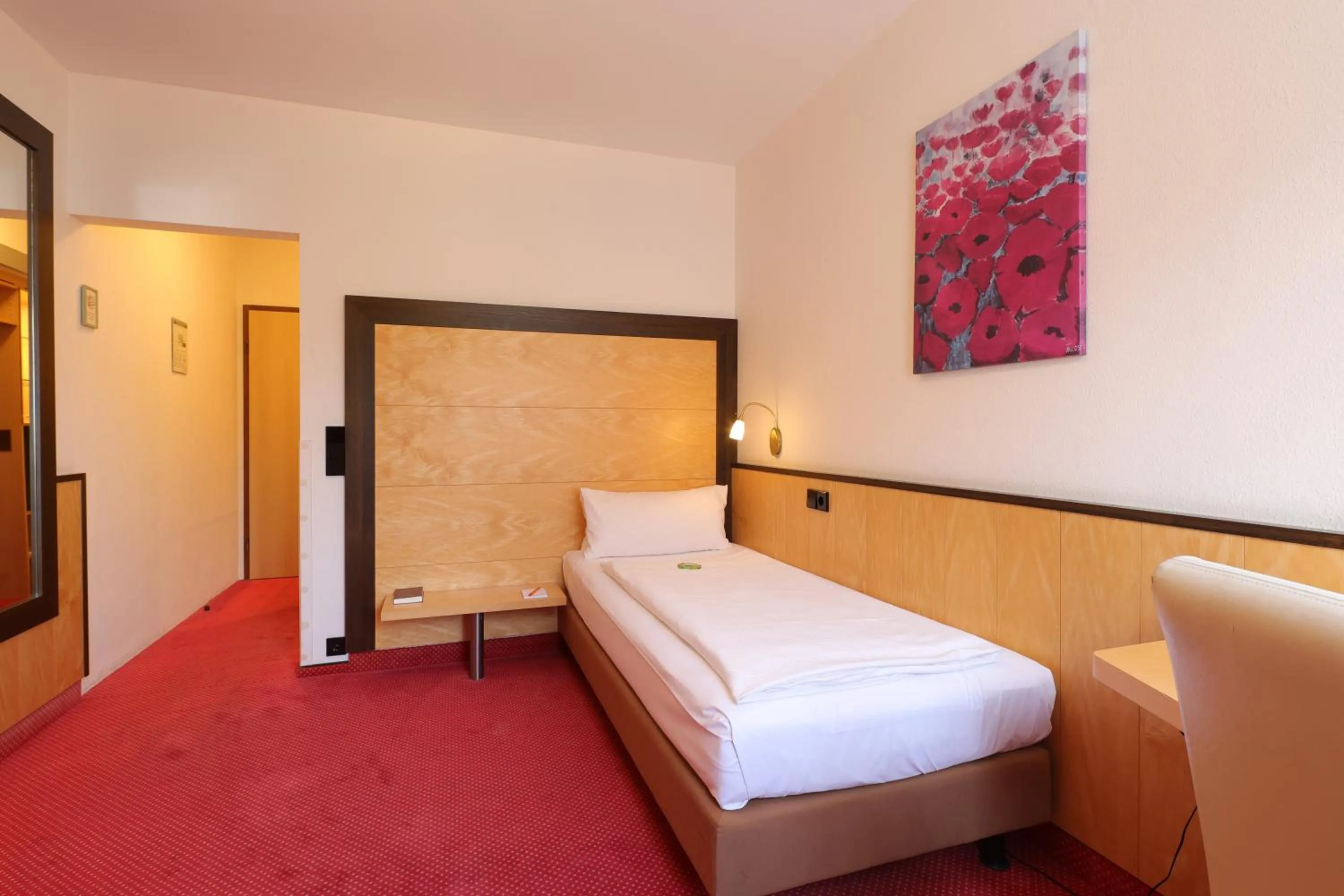 Bed in Aparthotel Deutschmeister