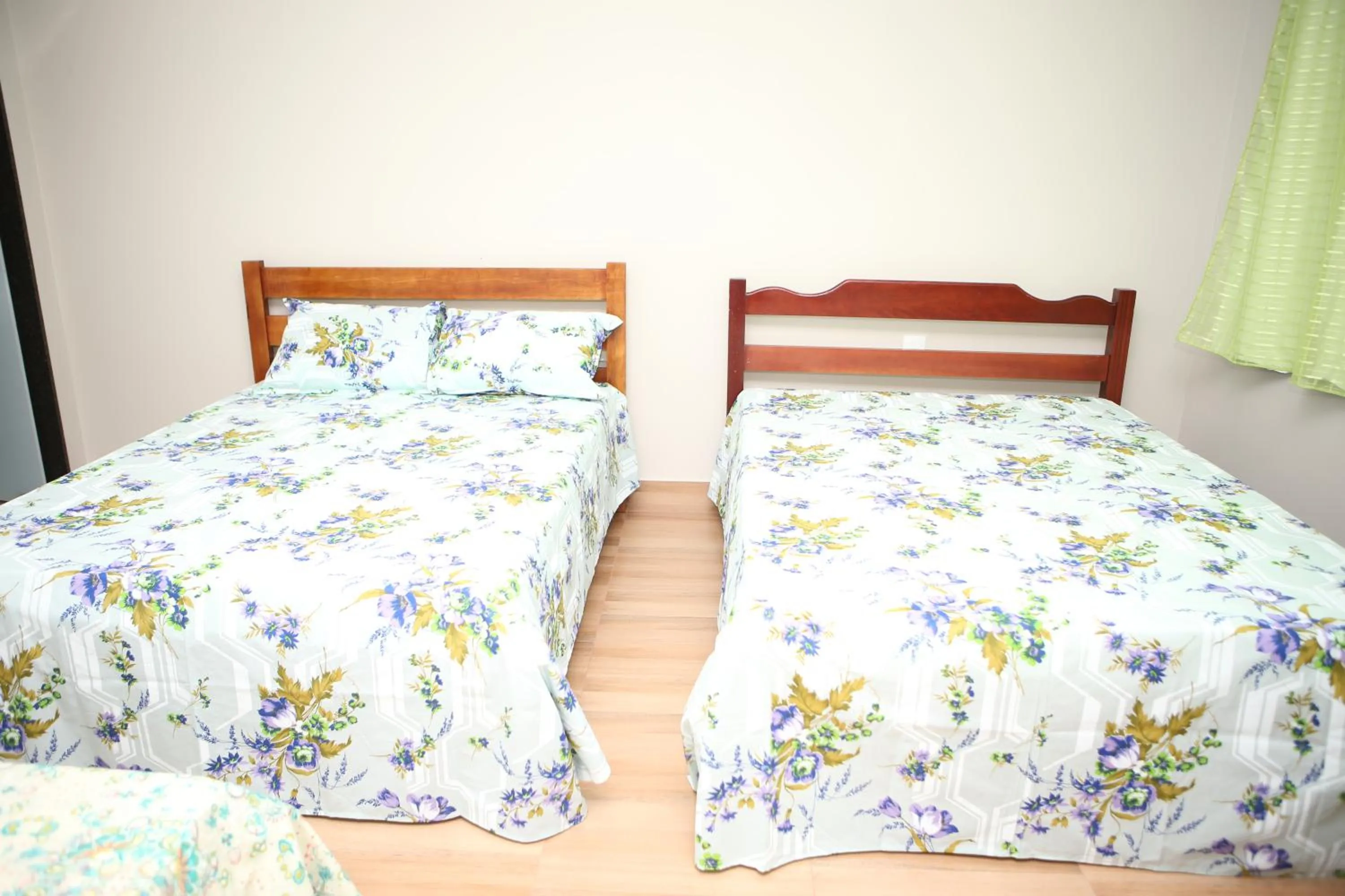 Bed in Pousada Pérola Mineira