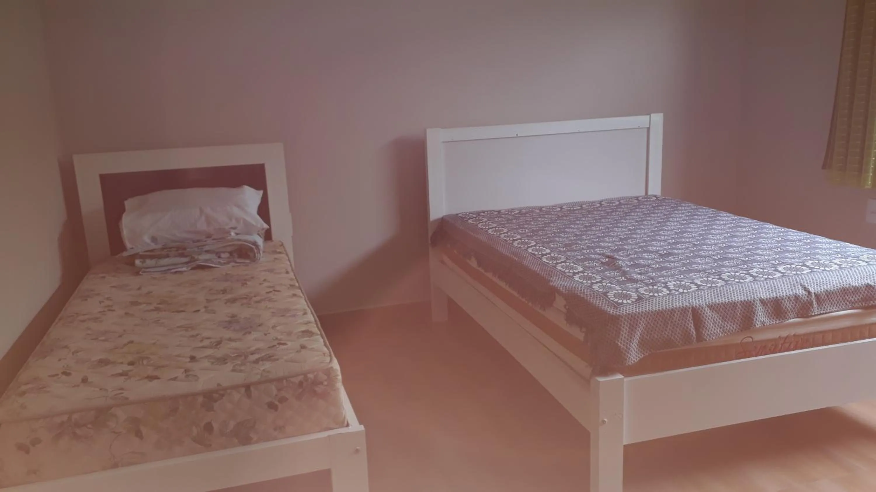 Bed in Pousada Pérola Mineira