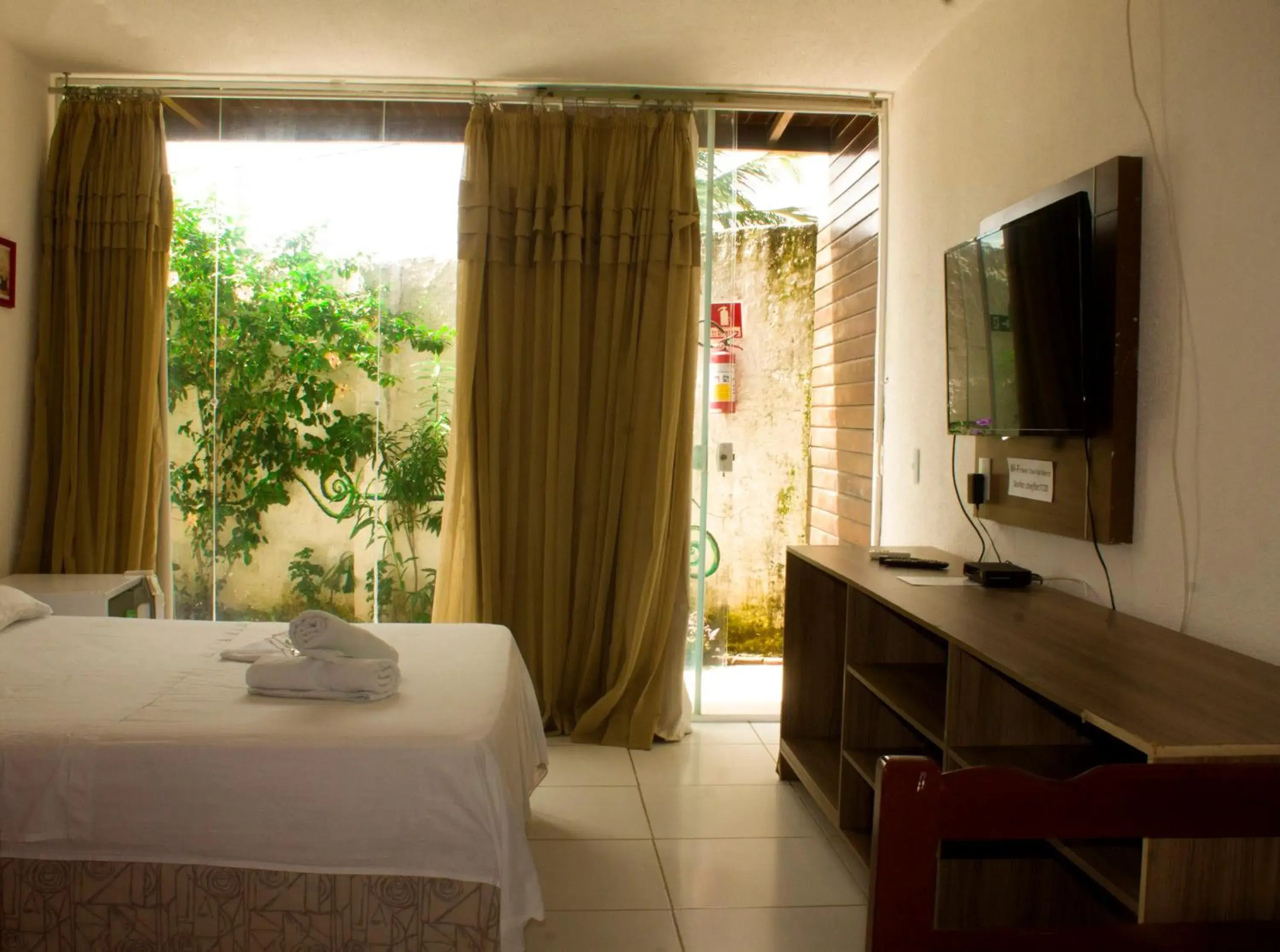 Triple Room in Pousada Brisa da Canoa Triple Room in Pousada Brisa da Canoa
