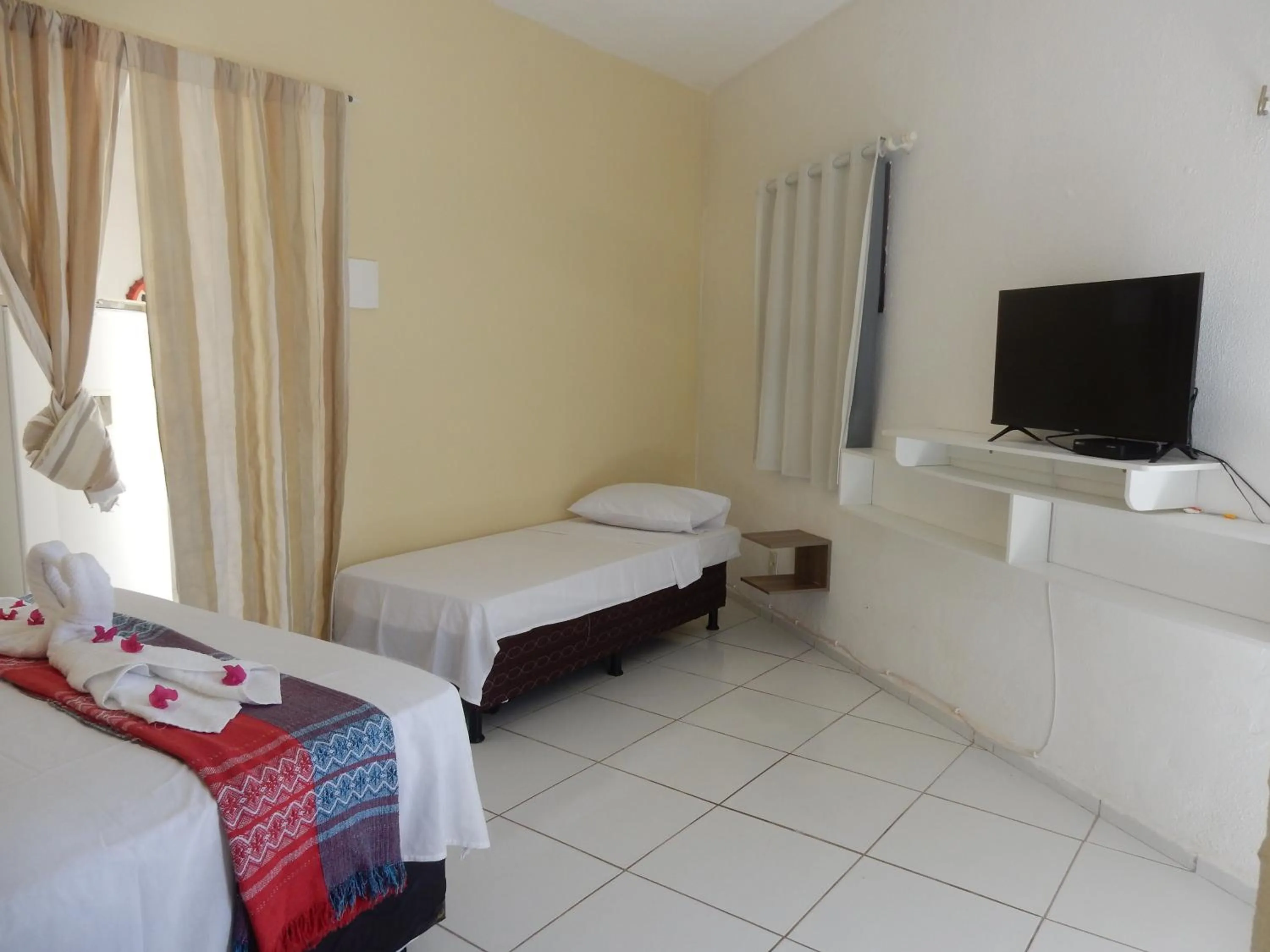 Bed in Pousada Brisa da Canoa