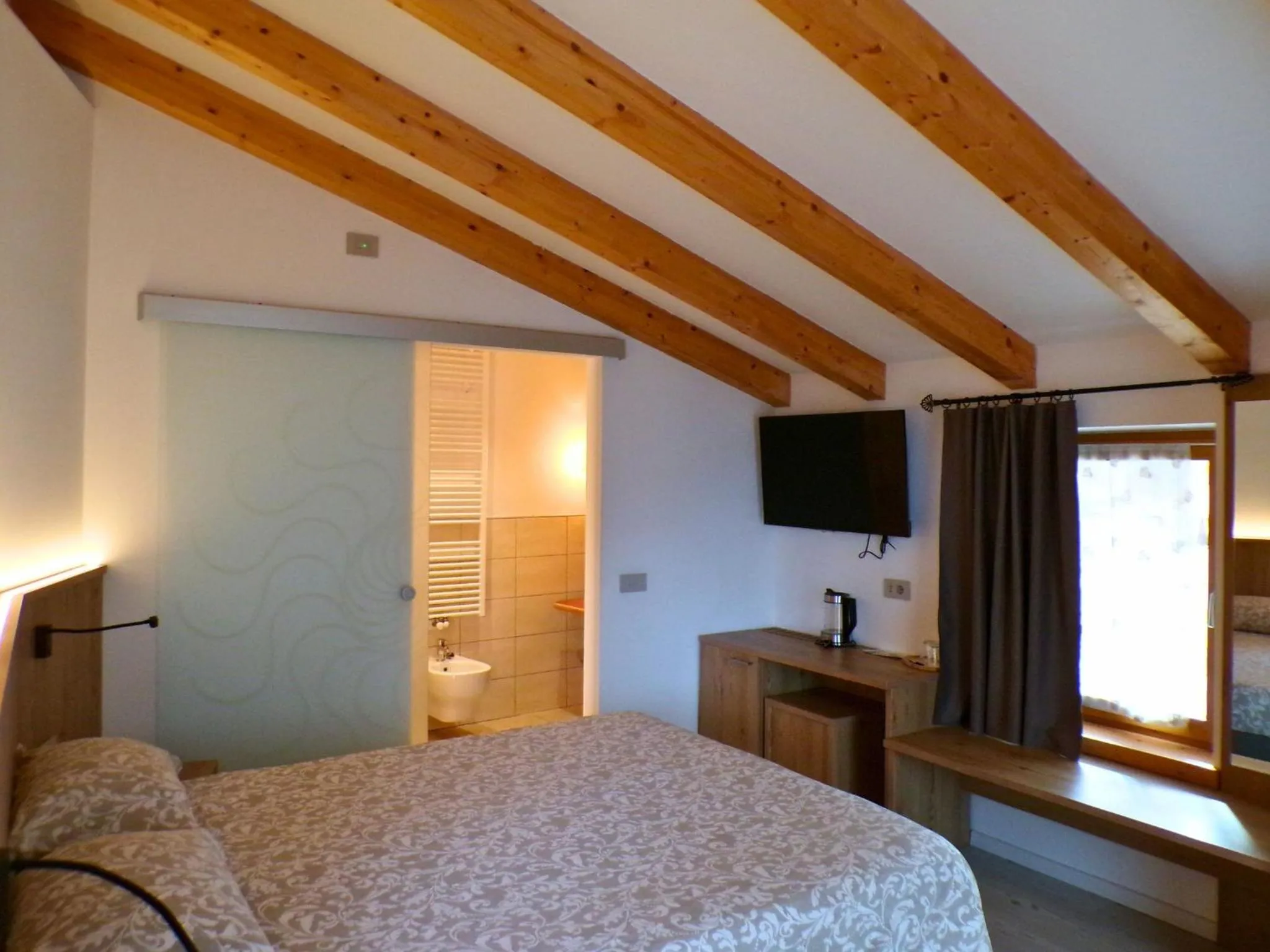 Bed in B&B Paganella Relax and Gourmet